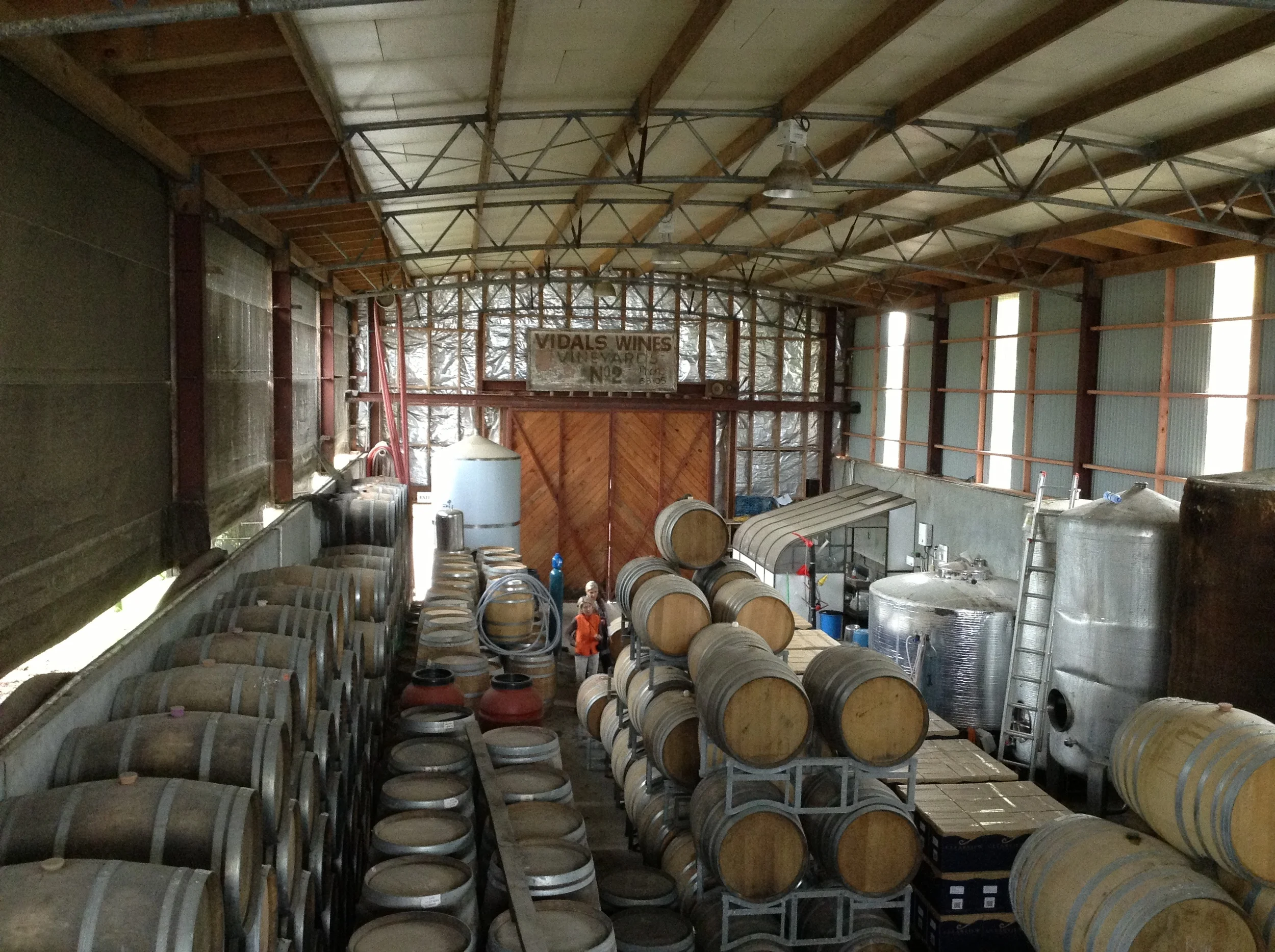 The barrel room is half-submerged in the ground to keep temperatures moderate. Note the Vidal wines vineyard sign, proudly displaying the land's viticultural history.