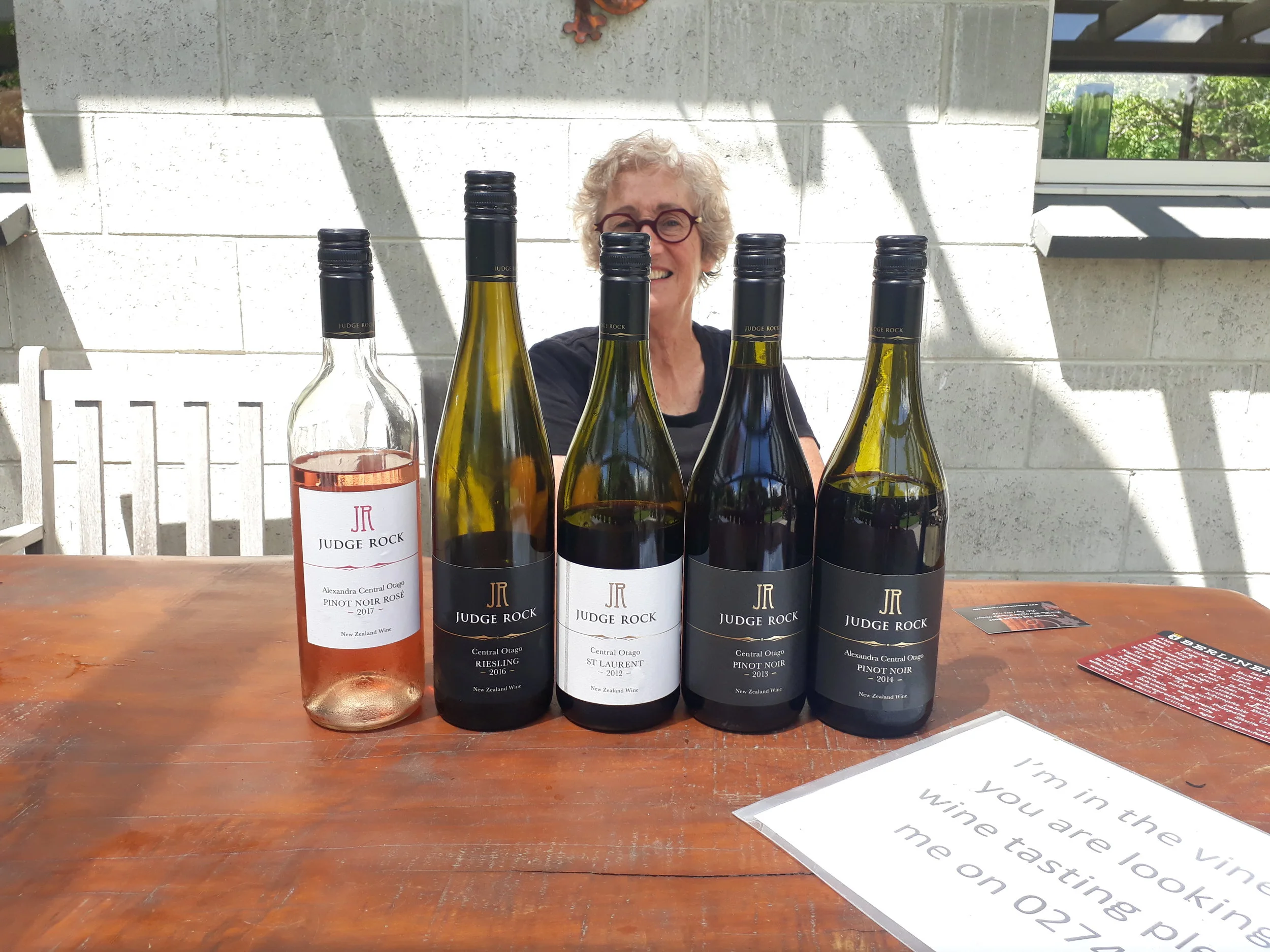 Angela Jacobson partially obscured as she talks through Judge Rock's range of wines.