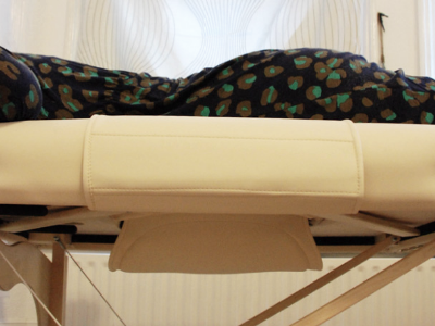 Pregnant women are able to lay tummy-down on this specially designed table.
