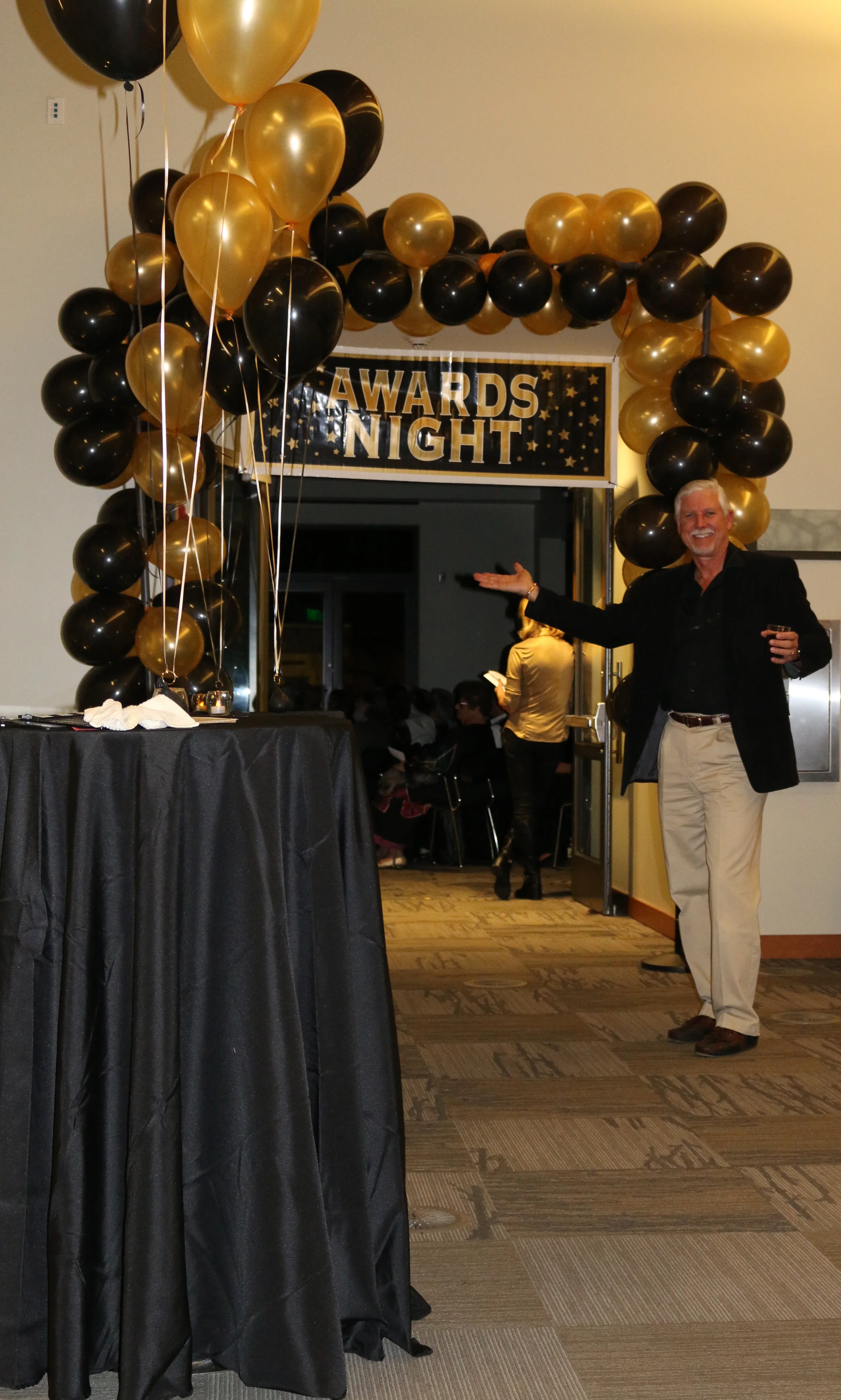 Volunteer photographer, Darby Howard, welcomes the crowd
