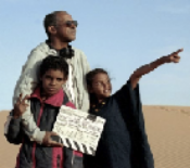 The filmmaker on the set, with the two child actors