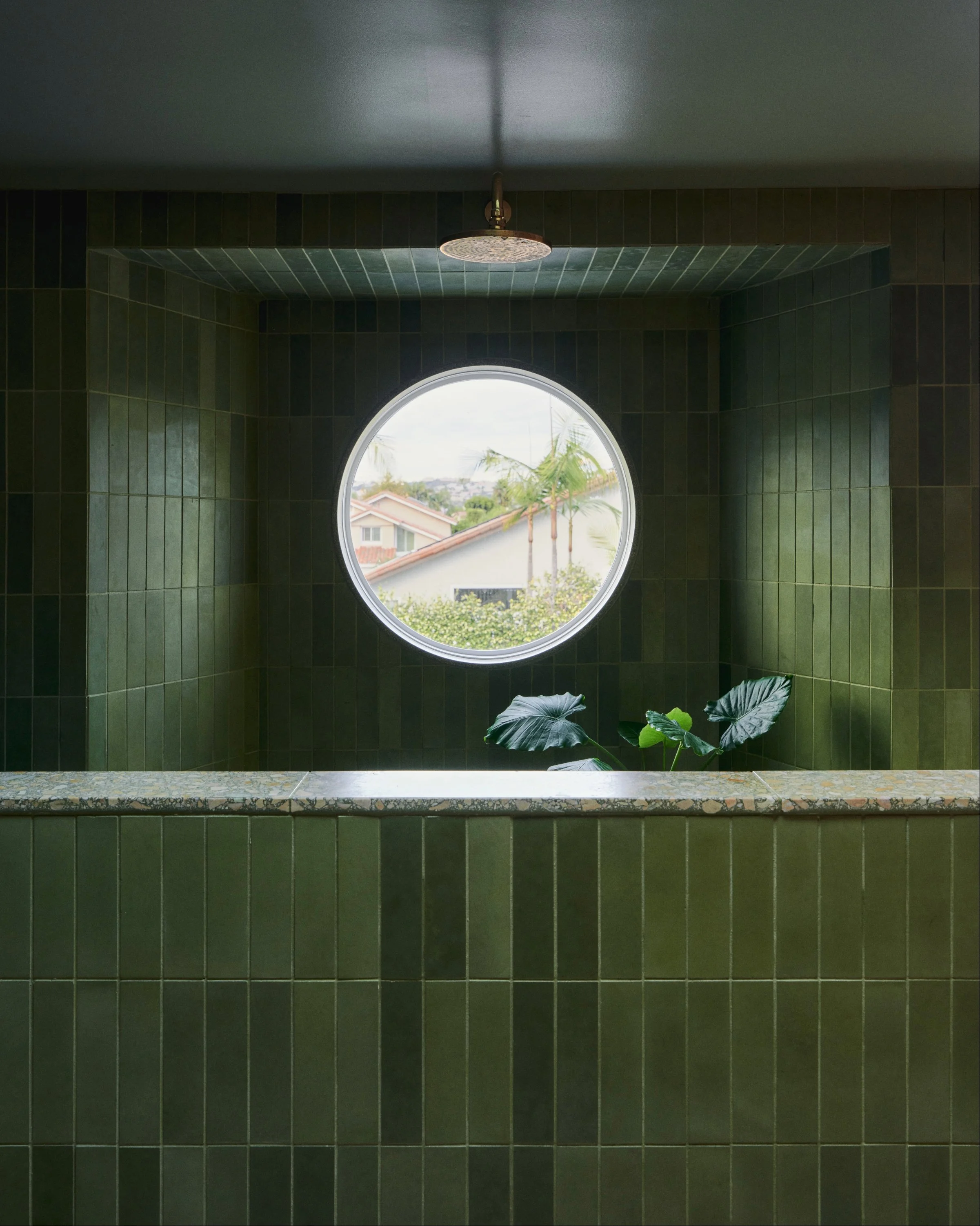 concrete collaborative green bathroom
