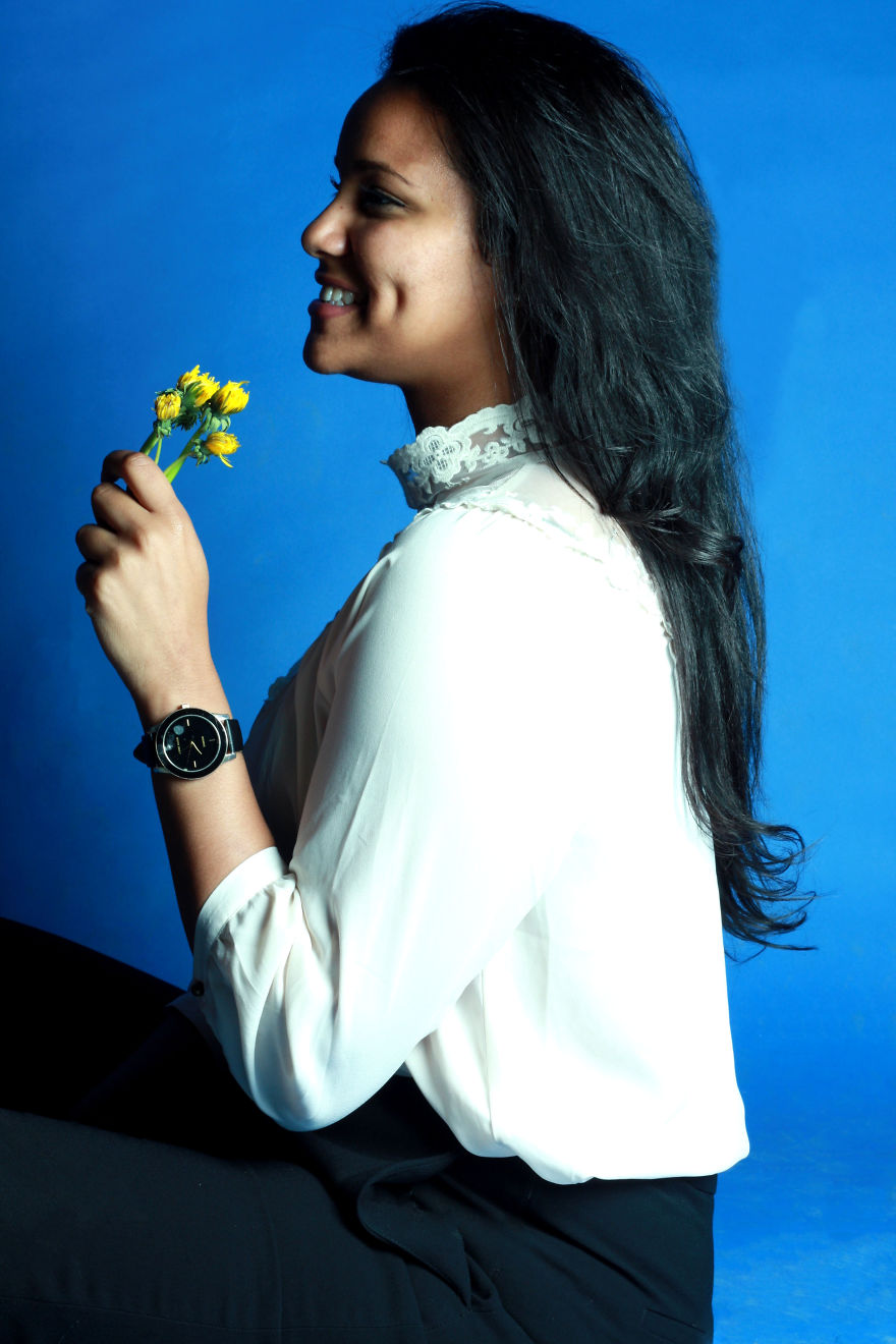 The essence I embrace…“Are my dimples. It’s funny; technically a dimple is considered a skin deformity, but I always saw it as a reminder of my childhood innocence.” NinyThe dandelions symbolize the idea of a plant being identified as a weed; an imp…