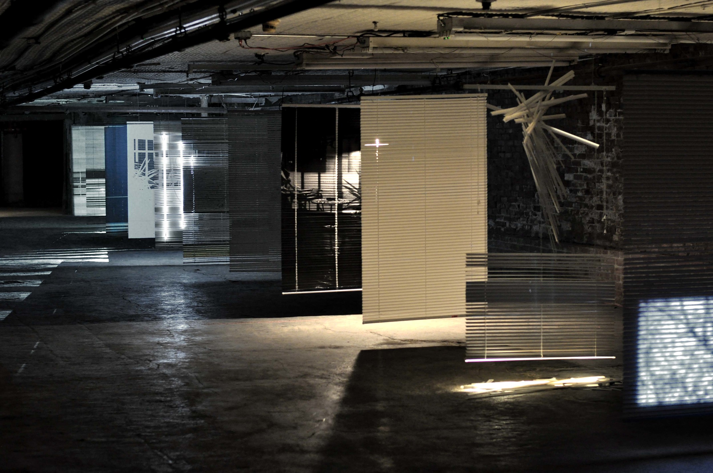 Days in Between (2015) vinyl blinds, video projections, neon, gold leaf, paper, c-print, fluorescent lamp, painter's lamp dimensions variable installation view, 47 Howard Street, New York, 2015