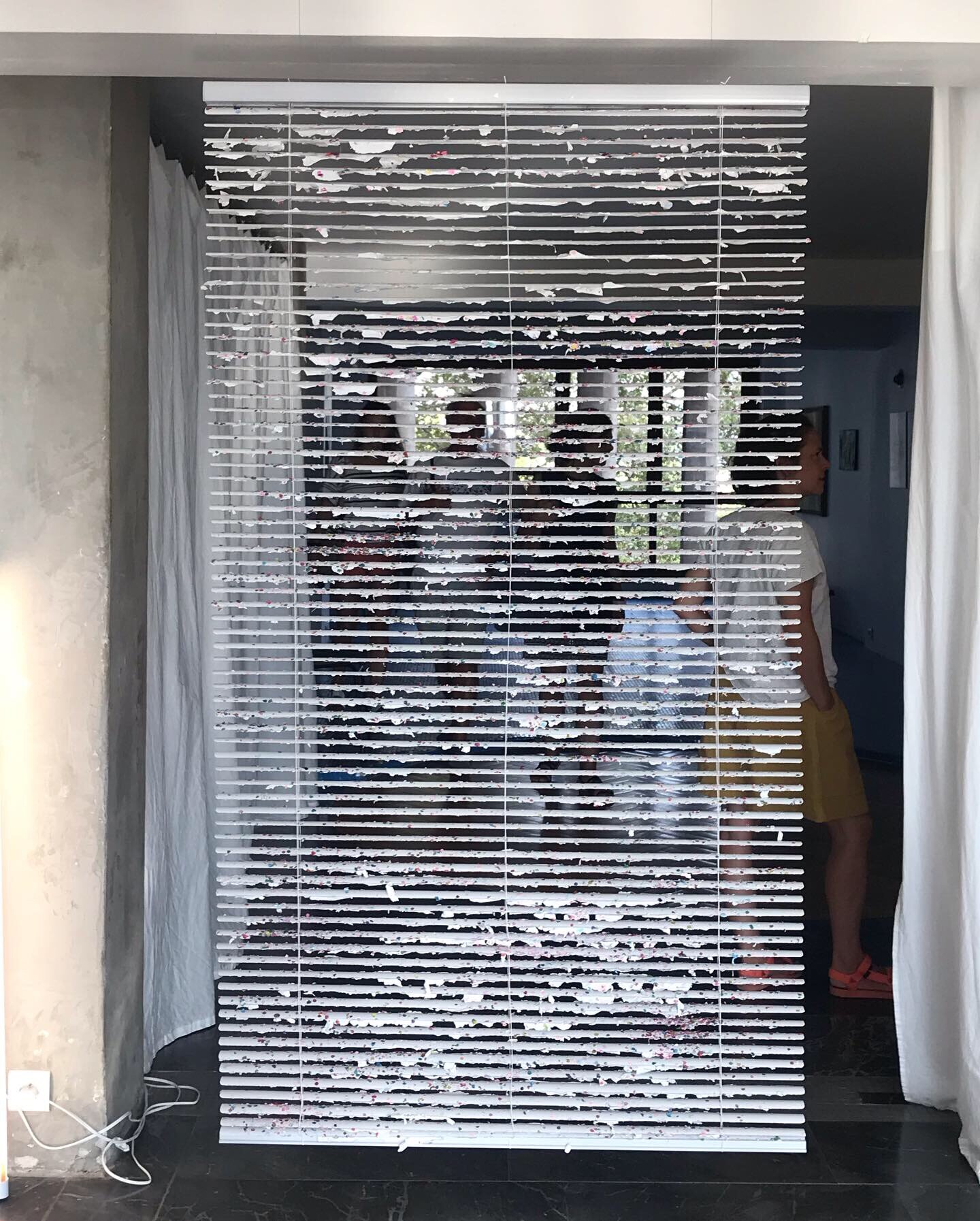   Confetti Blind , 2019 Mexican confetti, primer, acrylic on venetian vinyl blind 162 x 92 cm 