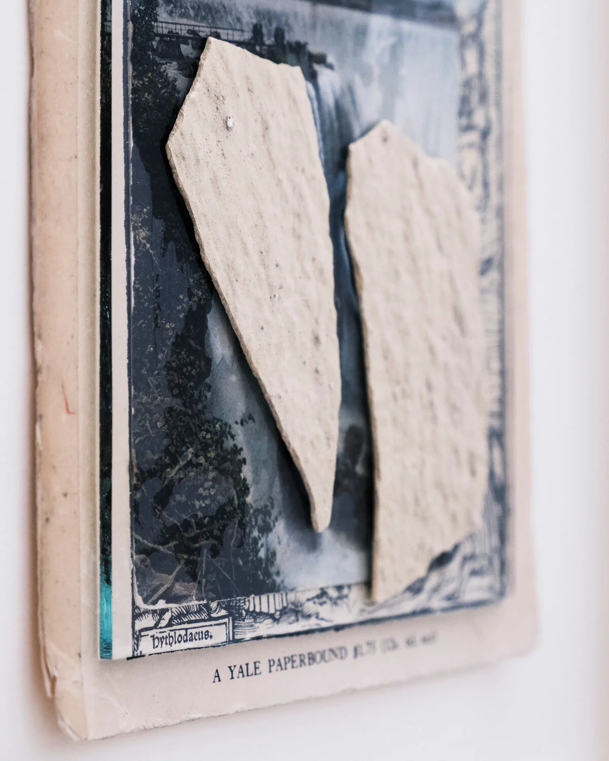   Utopia , 2019 (detail) After Thomas More ‘ Utopia ’ Book cover, postcard, fragment of wall (Cuba), oil on glass image: 20 x 13 cm ; 7 7/8 x 5 1/8 in frame: 27,5 x 22,5 x 2,5 cm ; 10 7/8 x 8 7/8 x 1 in  private collection  photo Jean Marques  