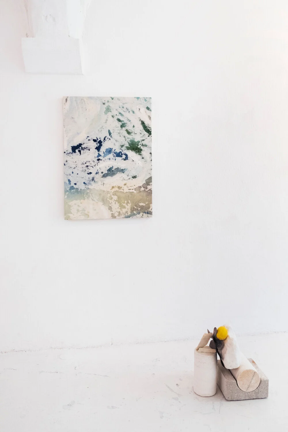 Reversed II , 2016- 2019 Gouache and gesso on canvas 91,5 x 66 cm ; 36 x 26 in & Lemon Eye , 2019 Fontvieille stone, aerated concrete, metal fans, lemon 40 x 40 x 25 cm ; 15 3/4 x 15 3/4 x 10 in installation view, Galerie Vaste Horizon, Arles photo Jean Marques