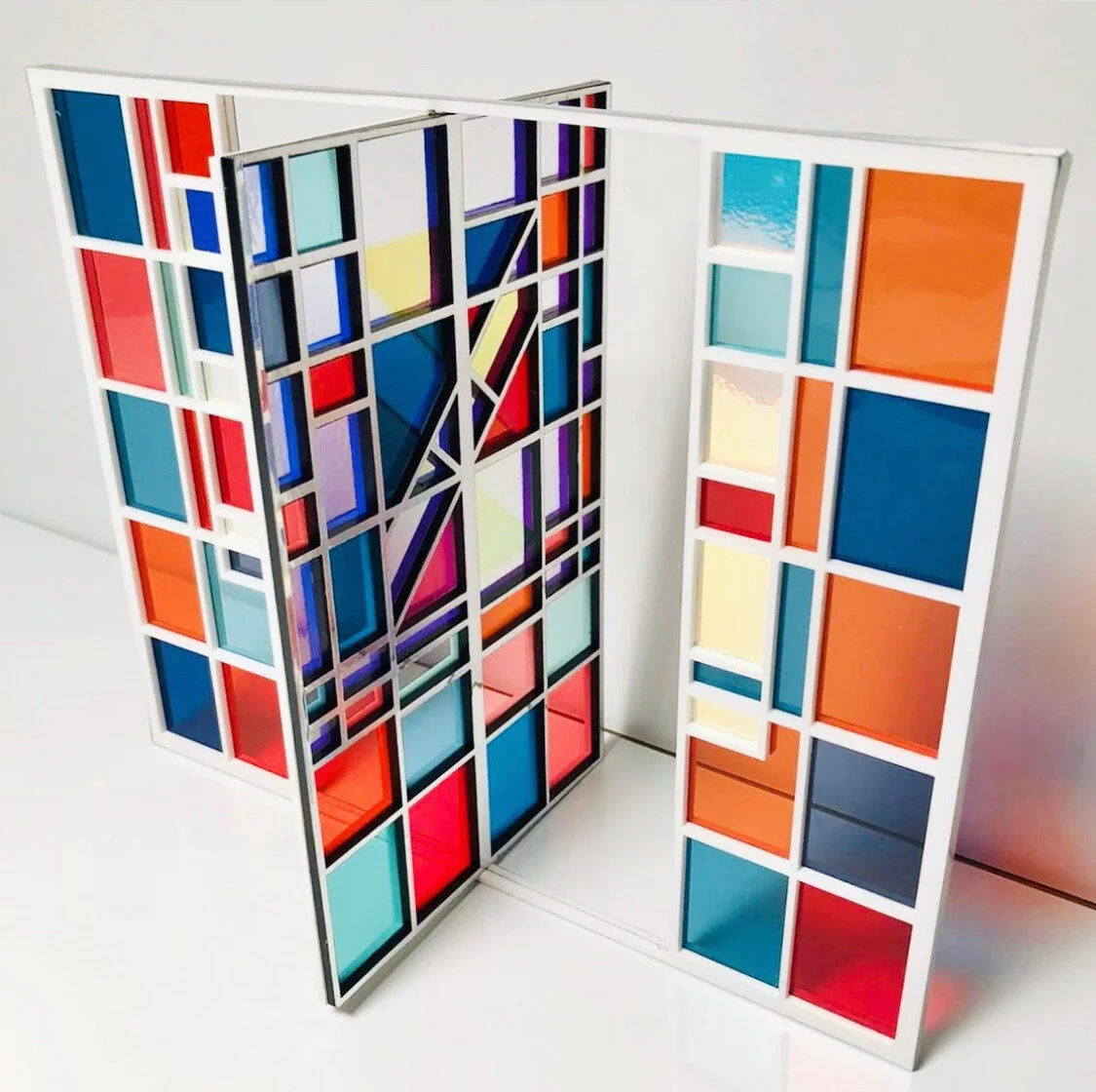   French Window (Checkers) , 2019 multiple (unique) acrylic, mylar, colored filters, iridescent film 26 x 21 x 12 cm 