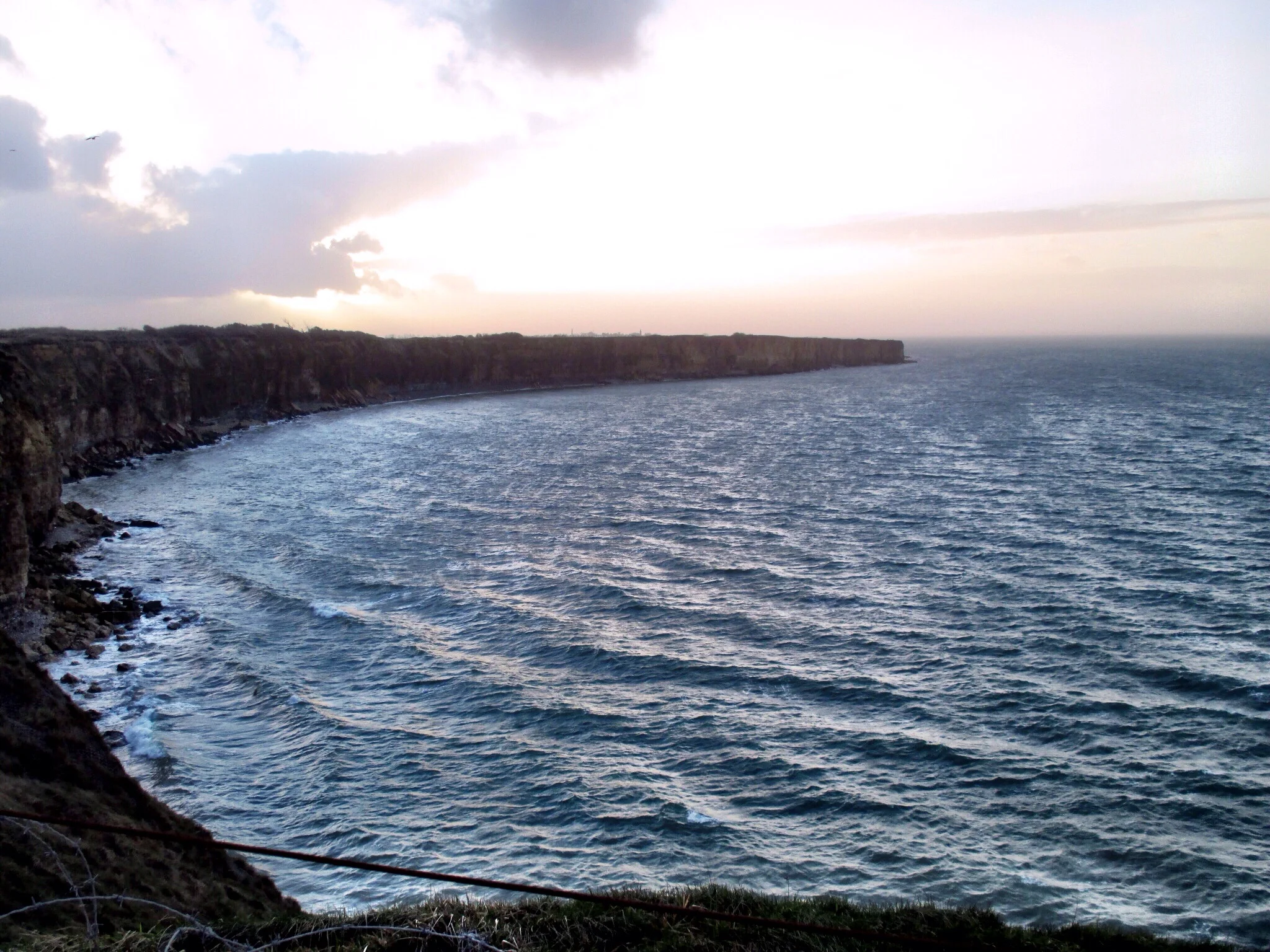 View west from Pointe-du-Hoc and the sheer cliff faces