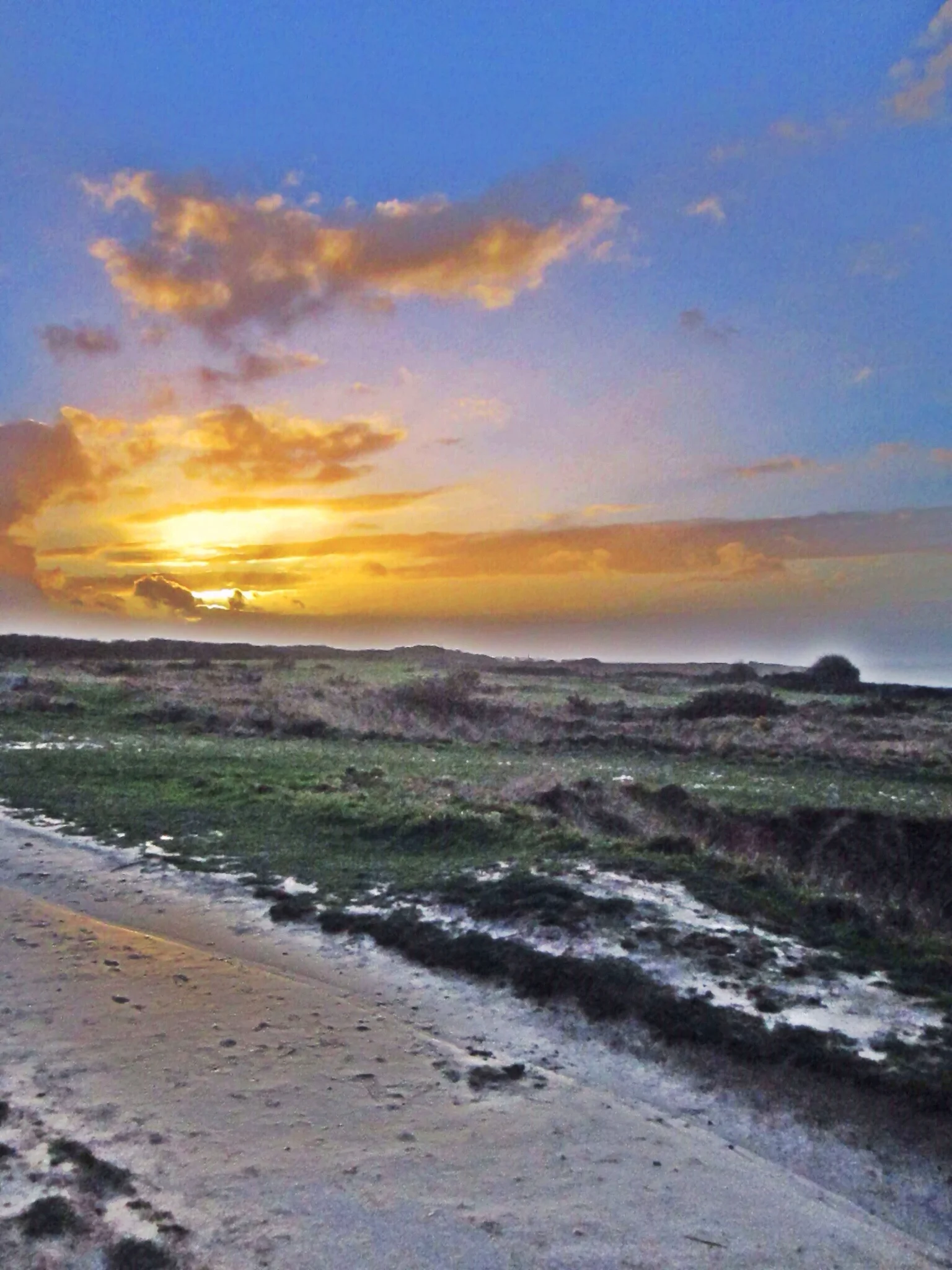 The sun sets on our Normandy tour at Pointe-du-Hoc