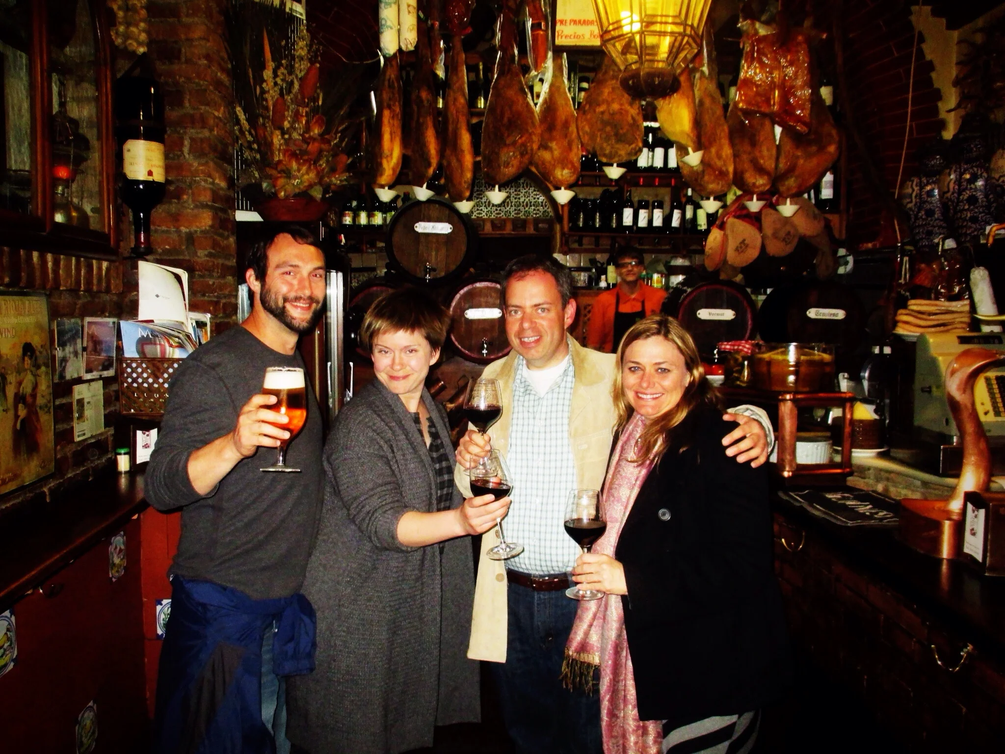 Toasting with our new friends at the last tapas bar of the night in Granada
