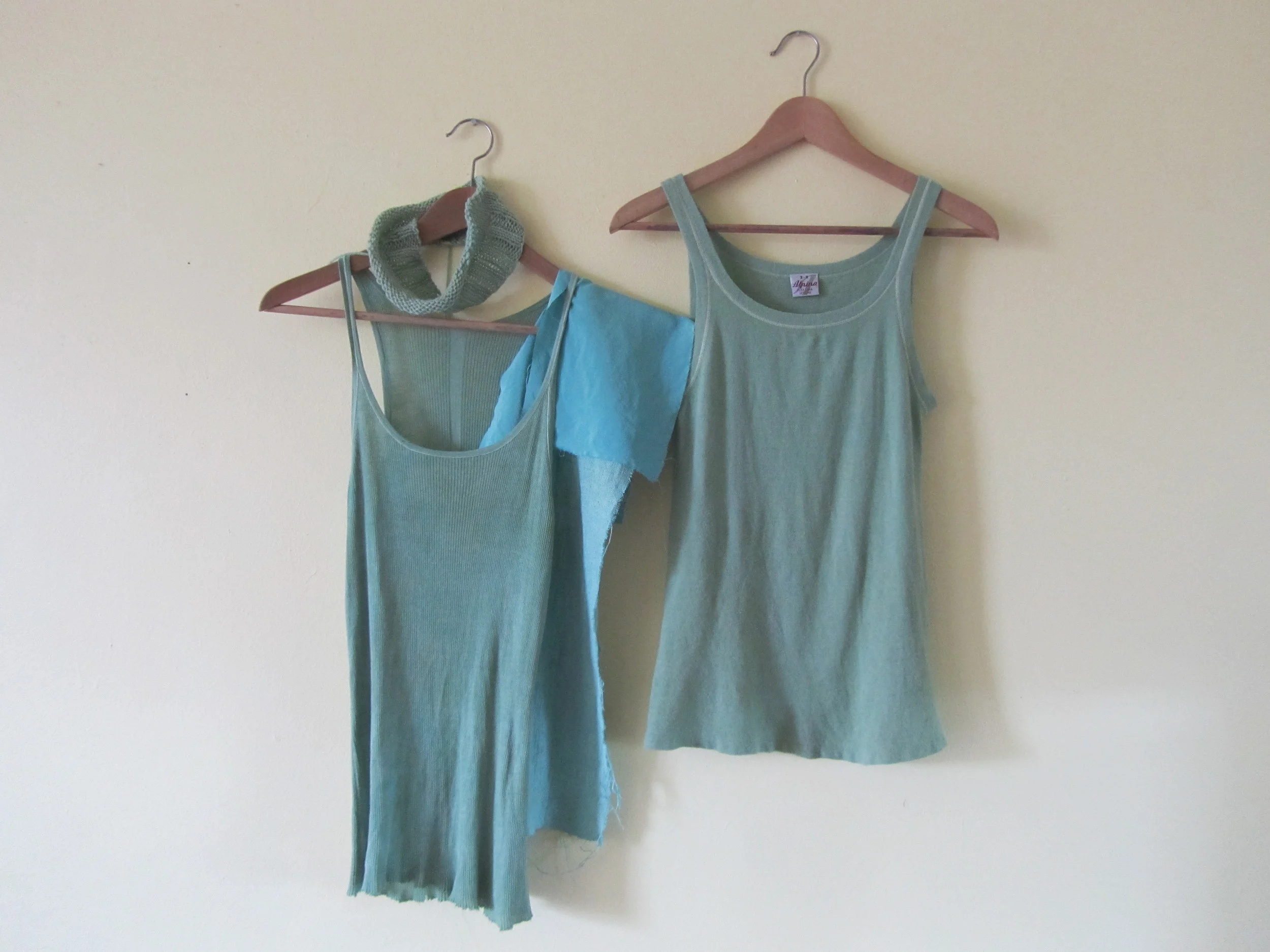 The finished result of the vintage wool top (right) and some other pieces I dyed with the fresh indigo leaves. The aqua blue pieces of fabric in the middle are silk.