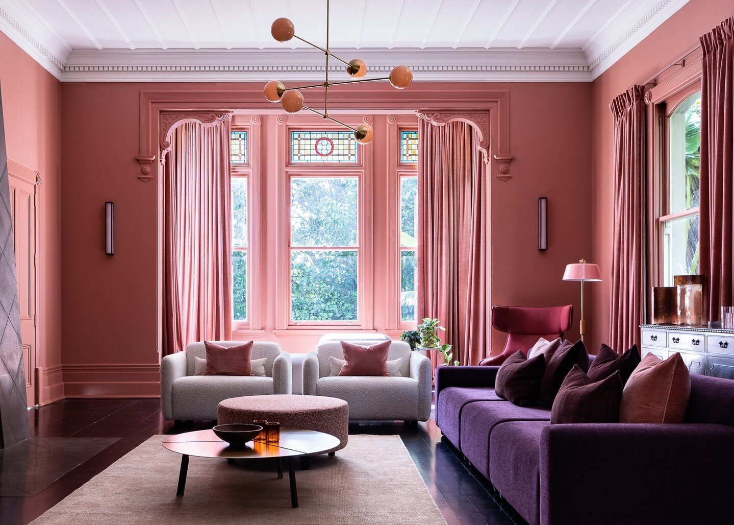 A unique, fearless response to their client's brief and love of colour, @at.space_nz have masterfully combined hues of dirty pink, purple and aubergine to transform a once monochromatic space into an intimate, cosy family lounge. ⁠
⁠
A finalist in th