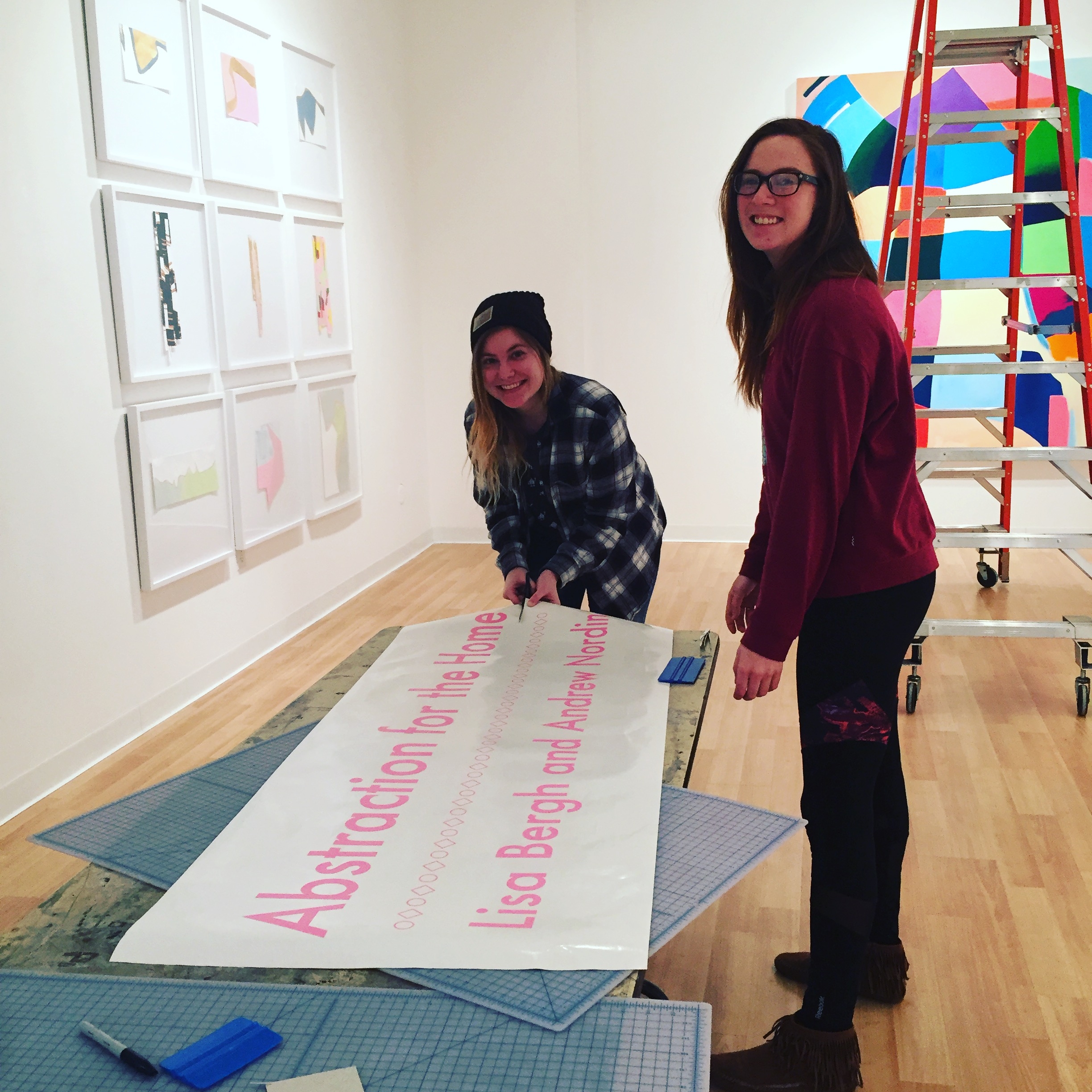 interns helping with signage at Catich Gallery 