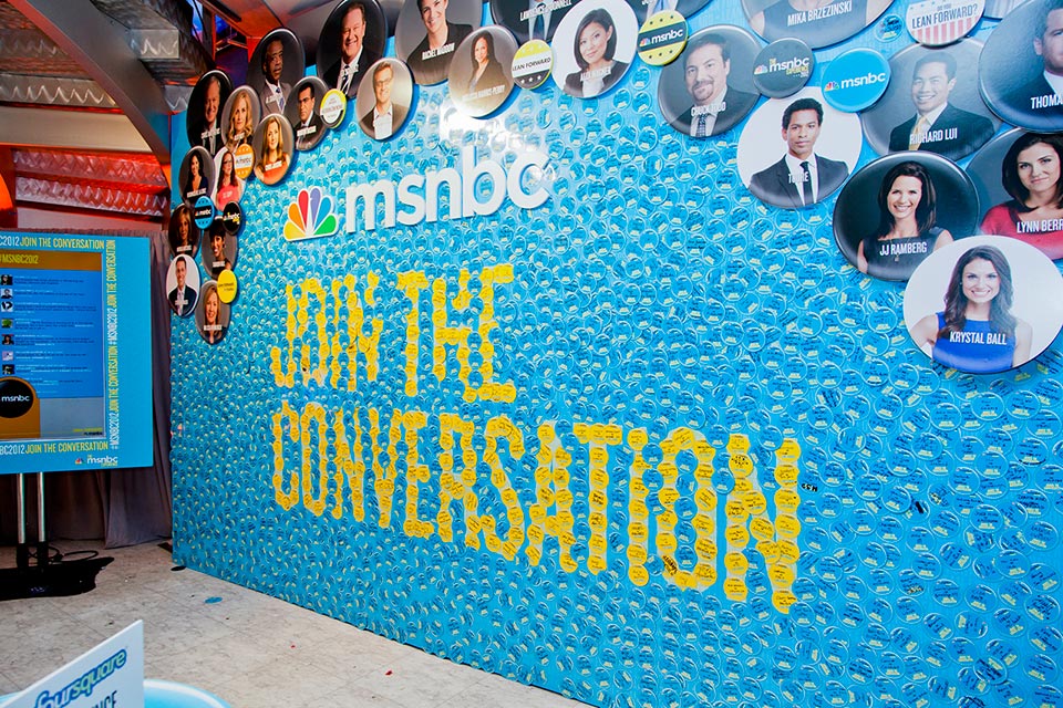  The interactive Conversation wall was constructed with a magnetic surface so that attendees could customize magnetic buttons. 