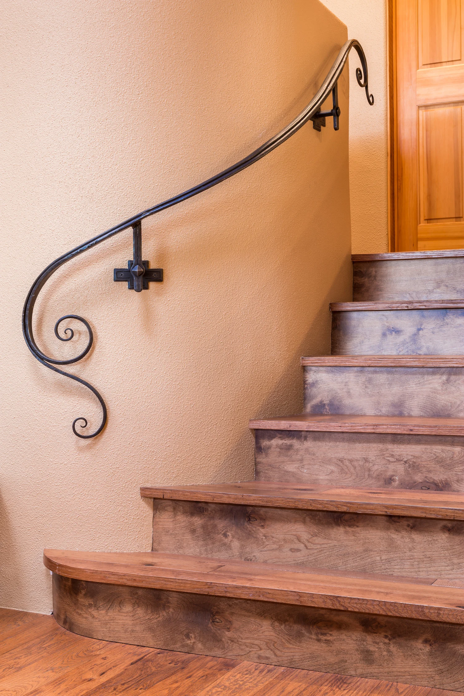 This custom iron handrail was designed & hand forged by Northwinds Forge