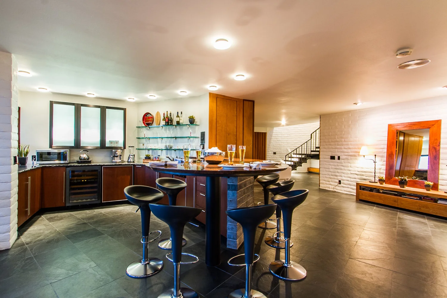 Lower level bar remodel with spiral teardrop granite countertop 