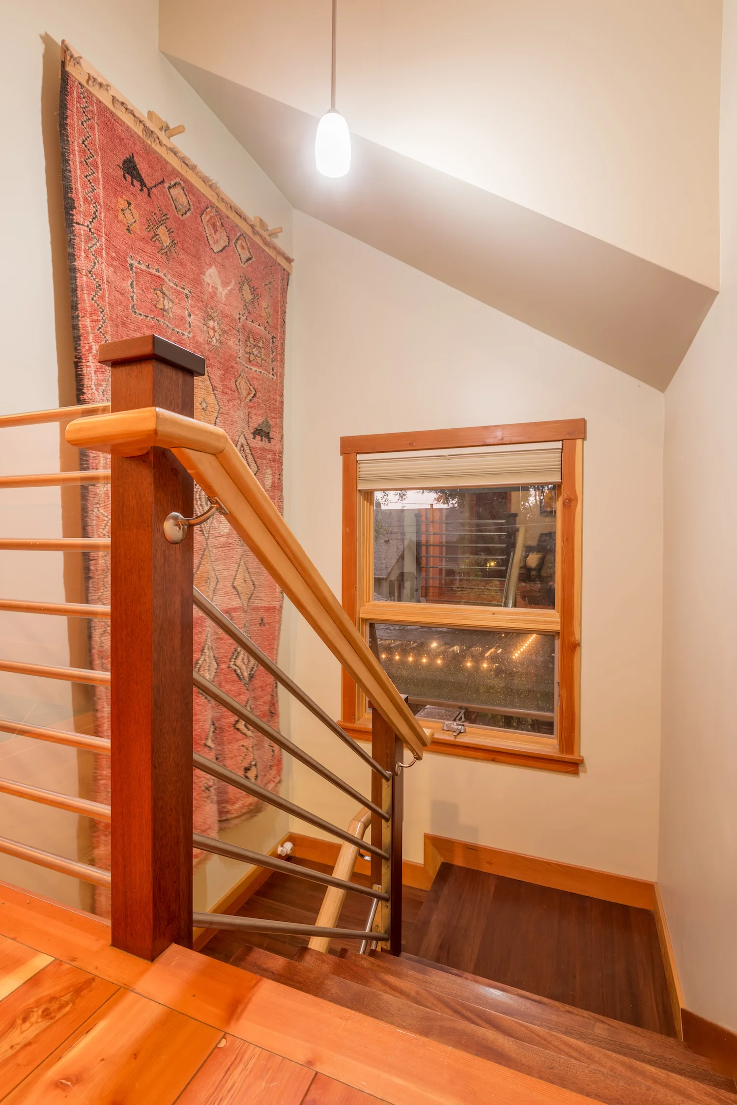 Stainless steel and maple rail with mahogany stair treads