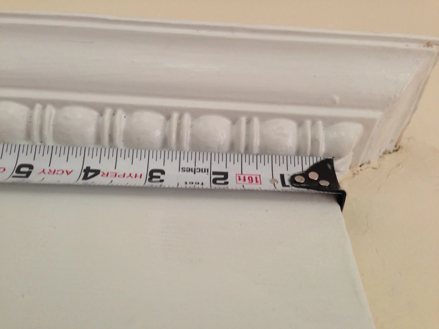 The bead and reel moulding and the door and window header cornices were the hardest trim details to match.