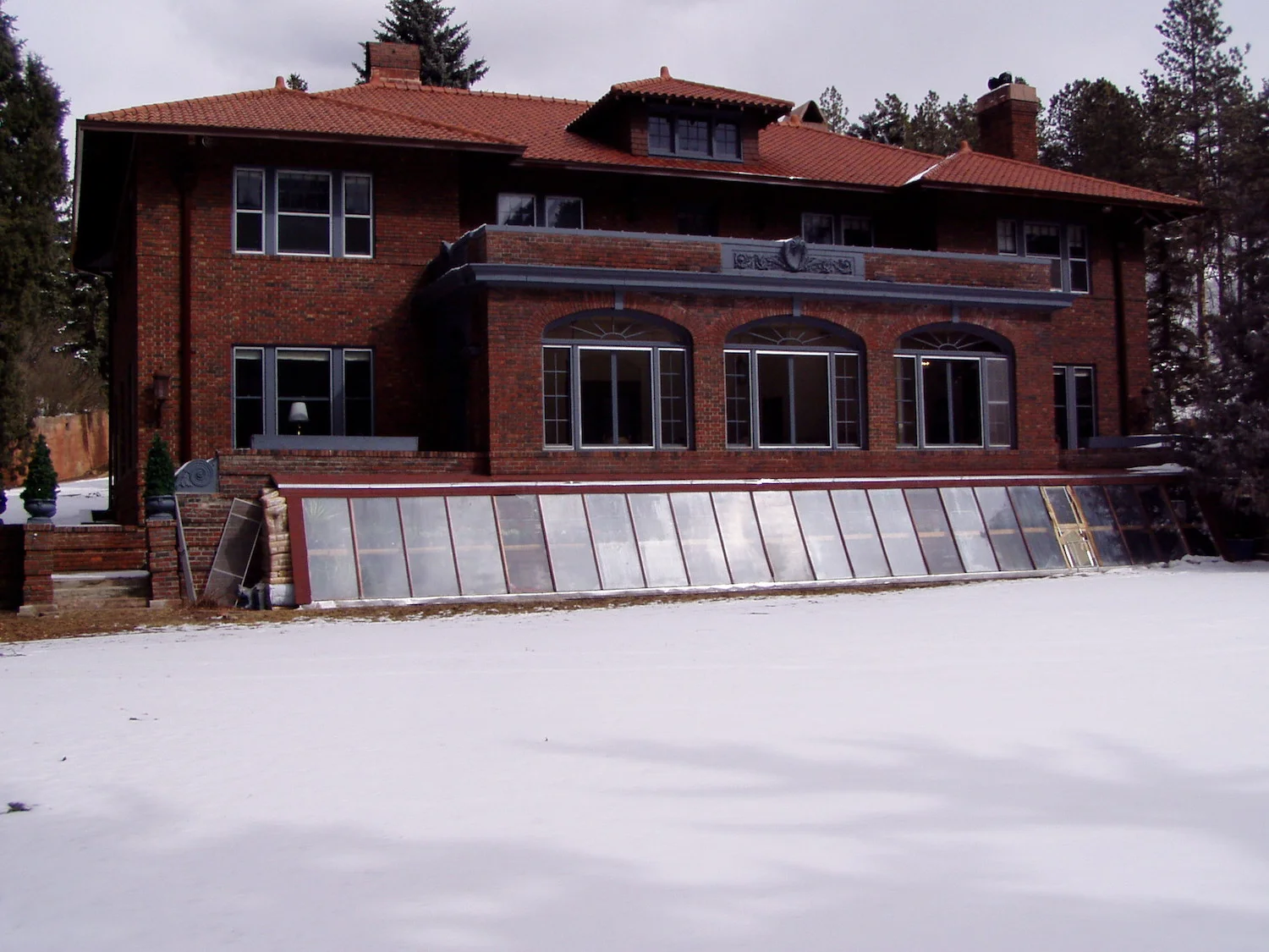  Before: The greenhouse/solar collector did provide some heat, but it was not very attractive and was causing the masonry to deteriorate. 