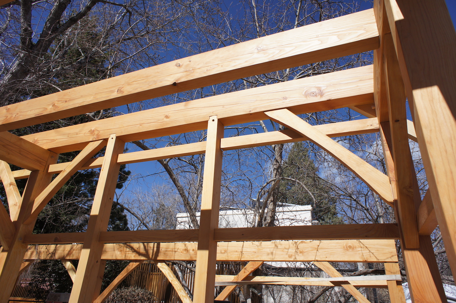 Intermediate posts dovetail into the beams.