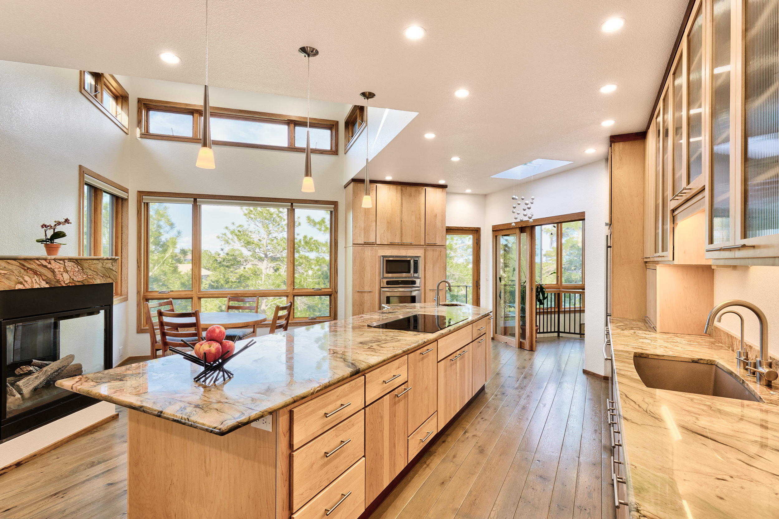 The clerestory windows add light and ventilation to the spacious kitchen. The breakfast table affords a great view of the ravine. 