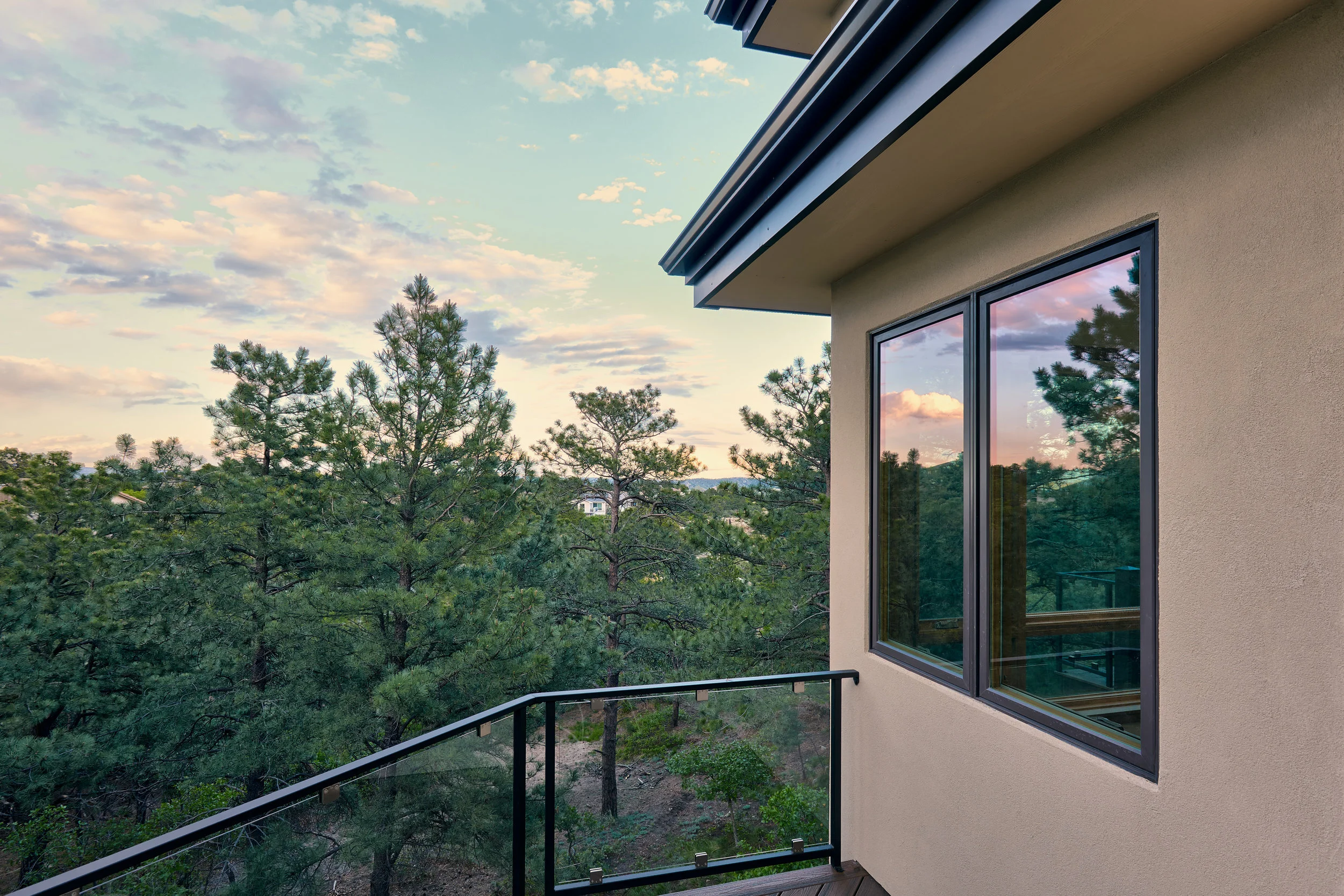 Metal clad fascia and stuccoed soffits are beautiful, low maintenance, and add to the fire resistance of the exterior.