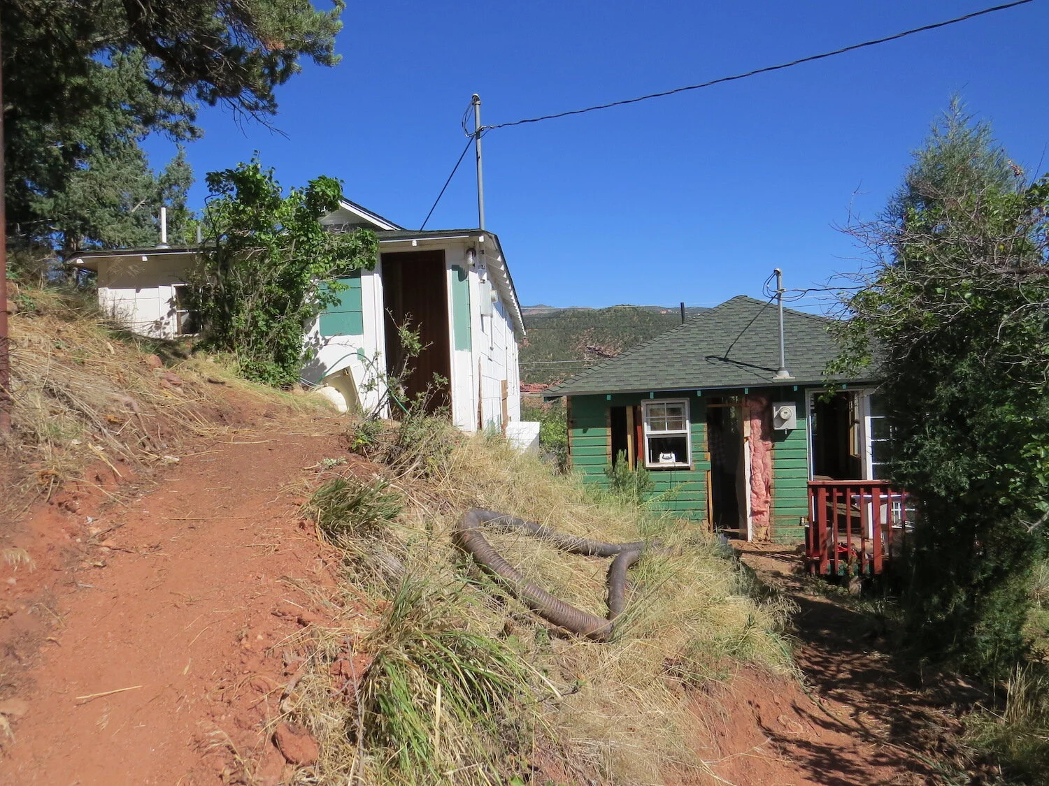  The hillside site  made construction more complicated. Erosion control was was a major issue.  Asbestos siding on the upper cabin was removed by an abatement crew. 