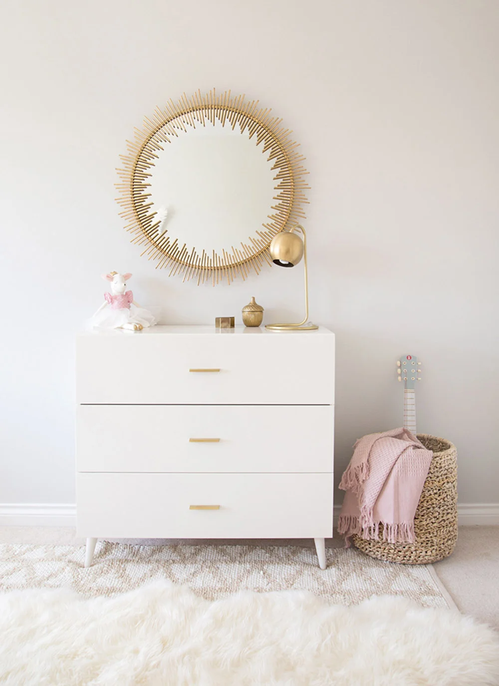 white mid century modern dresser in girls room