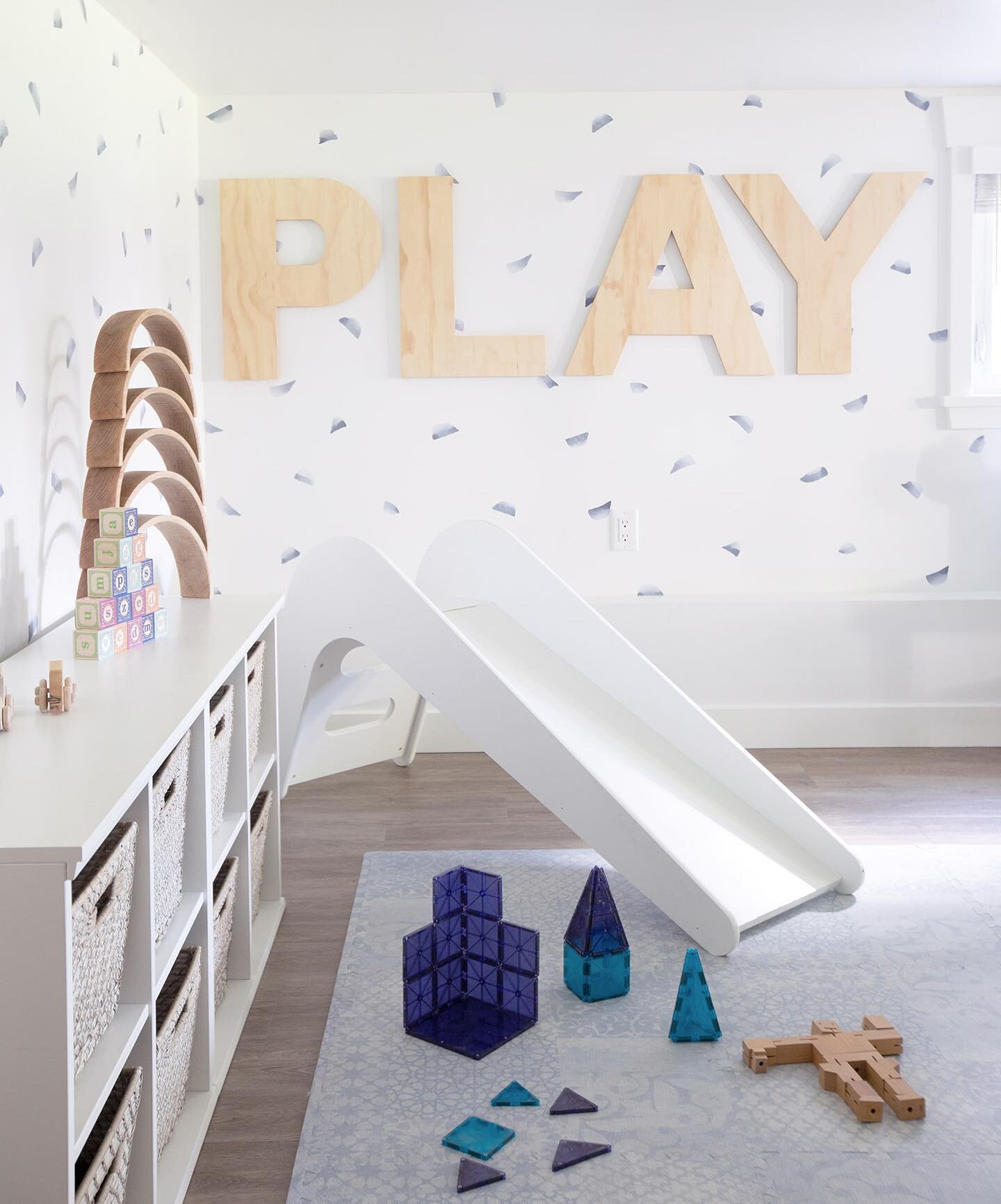 A bright + happy basement playroom to have fun in. We decorated this space with those goals in mind and added the foam rug for safety. The addition of natural wood in the wall letters and stools adds a layer of texture.

#modernbasementplayroom | Pho