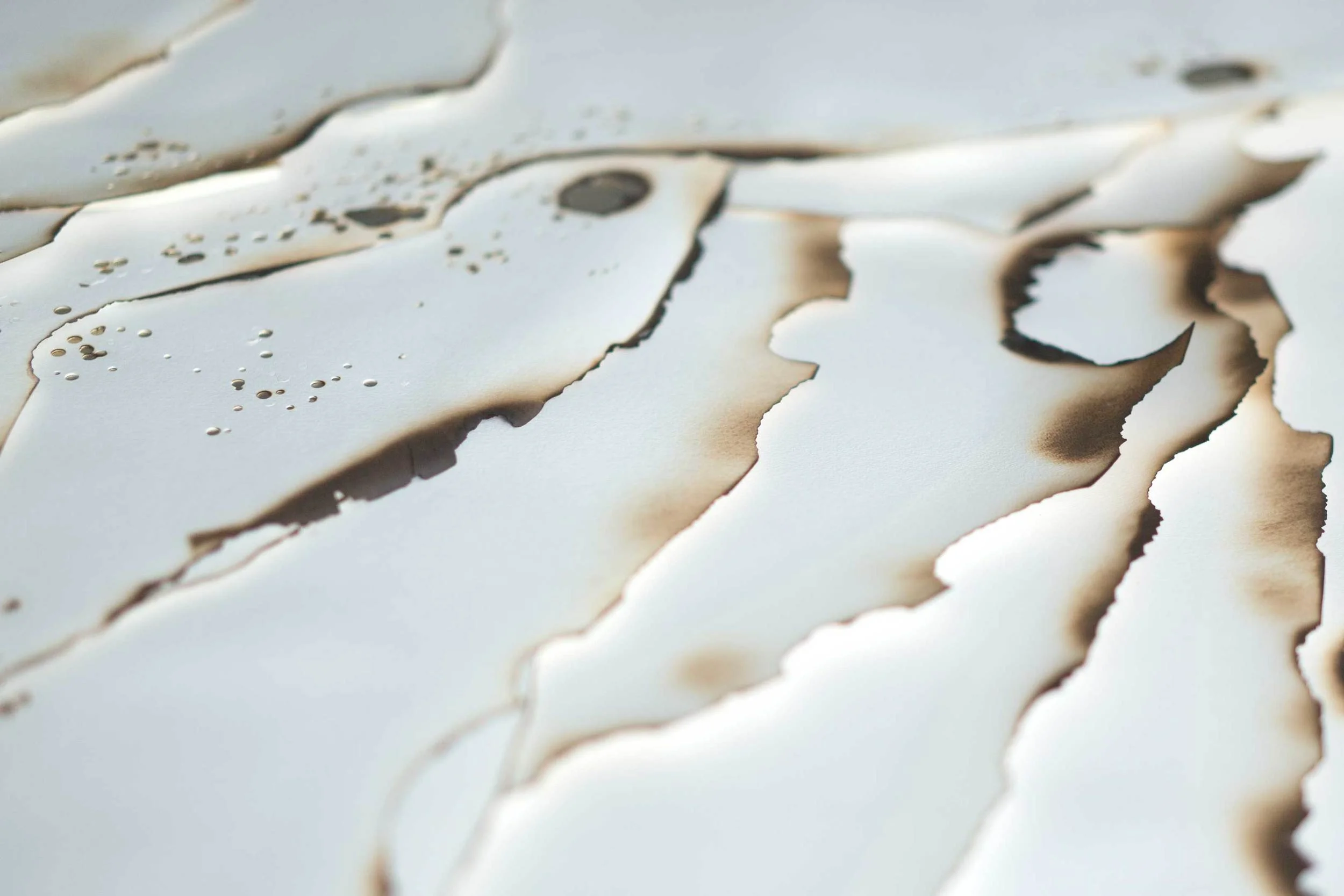 Kelly M. O'Brien, Playing With Fire No. 25 (Place 1) , detail. Paper, gold leaf, ink, flame. 35.5 x 29 x 2.65 inches. ©2016. Commissioned for The Address Boulevard Dubai, Dubai, UAE
