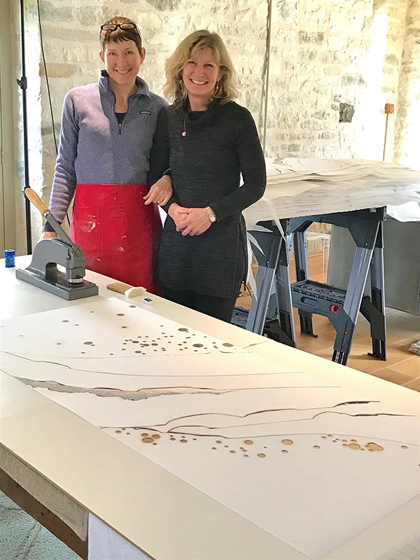 Big smiles as we near the end of a large run of variable edition hand-embellished prints. Kelly O'Brien and Pip Falkner-Lee.