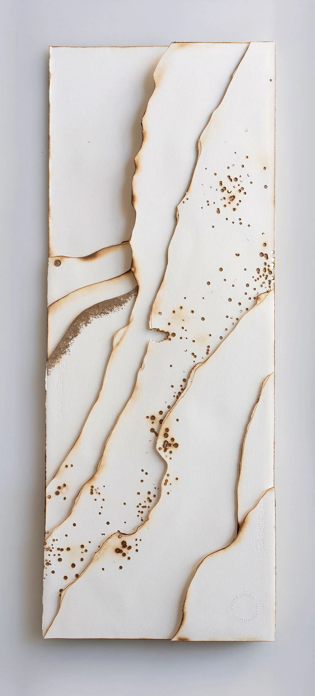Kelly M O'Brien, Playing With Fire No. 91. Paper, gold leaf, flame. 36 x 14 x 1.5 inches. 91 x 36 x 4 cm. ©2019 | Commissioned as a set of four for Norwegian Cruise Line Getaway.
