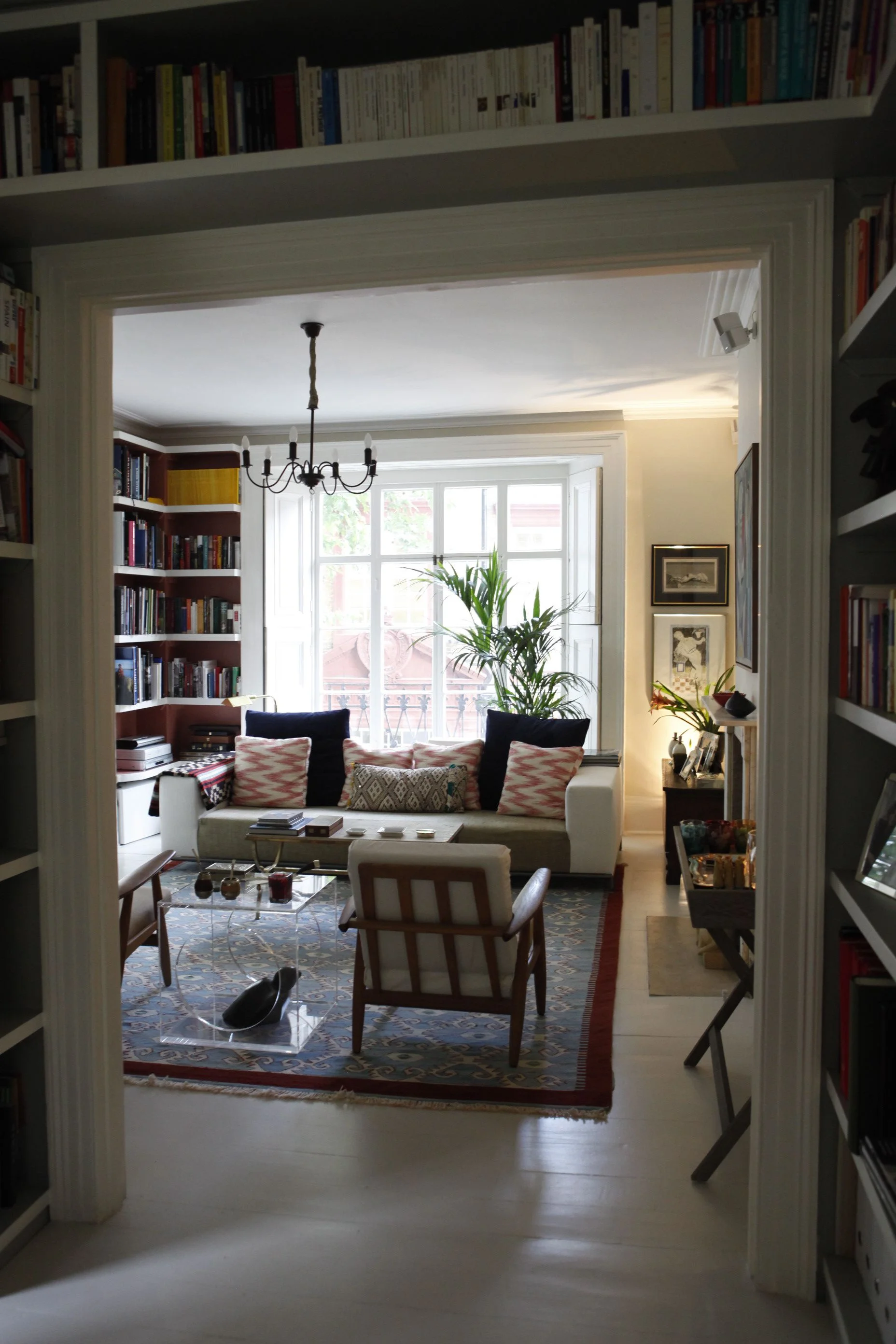 Bookshelves sit above door leading from study