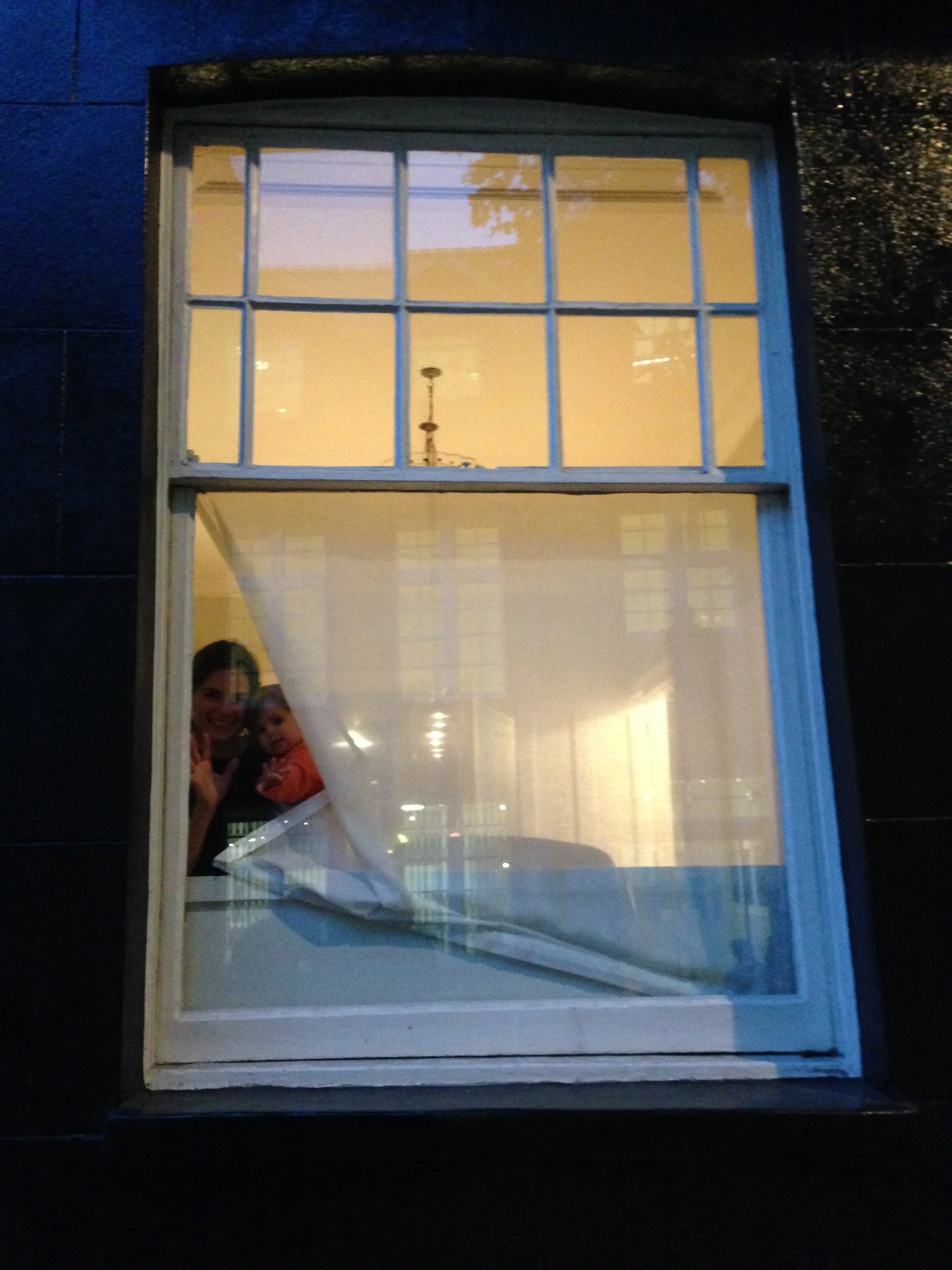 Me with my daughter, behind a 'nun's veil' muslin that covers half the window but still let's in lots of light.