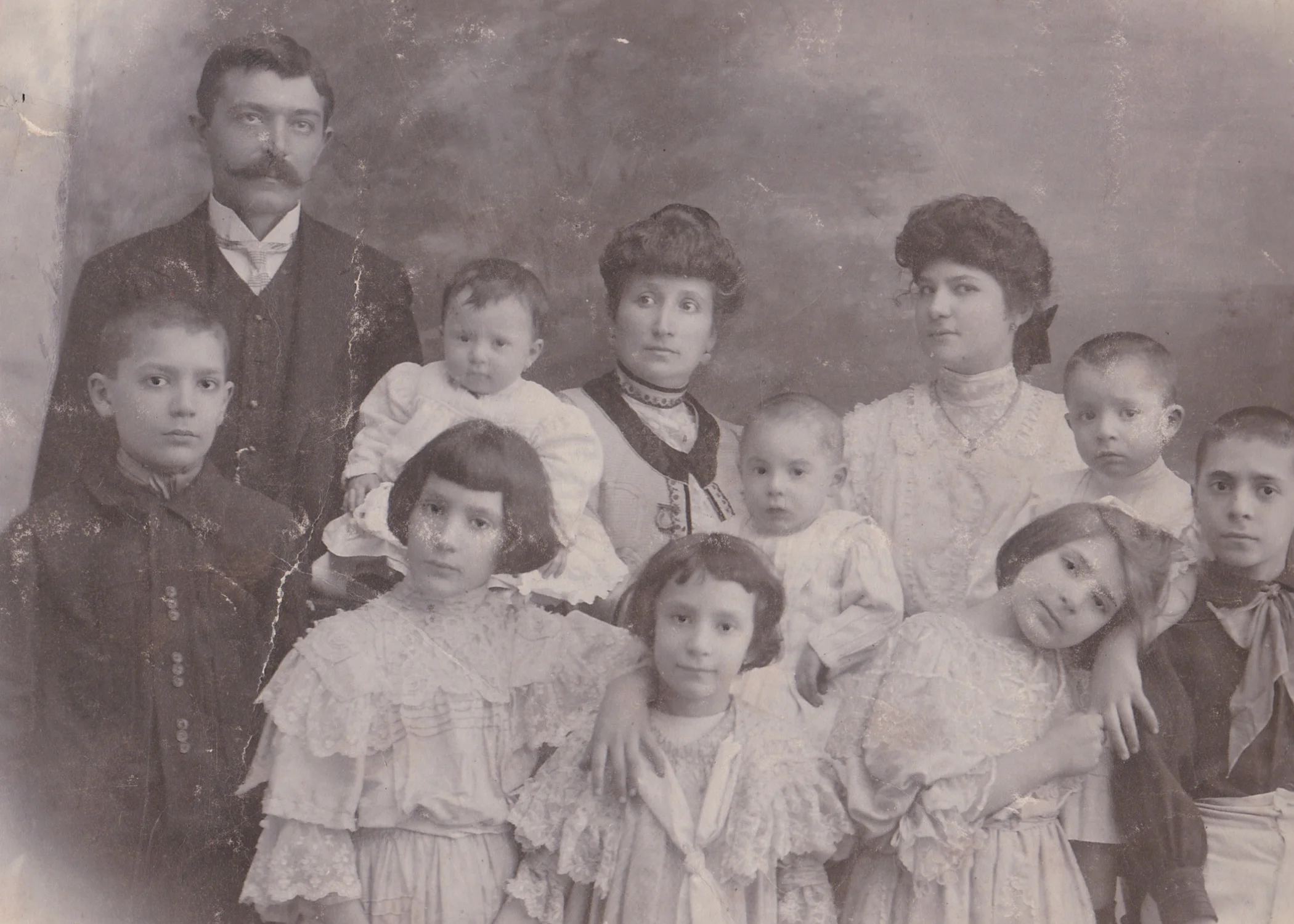 My great-grandmother Tina (front, bottom center) with her siblings and parents. 