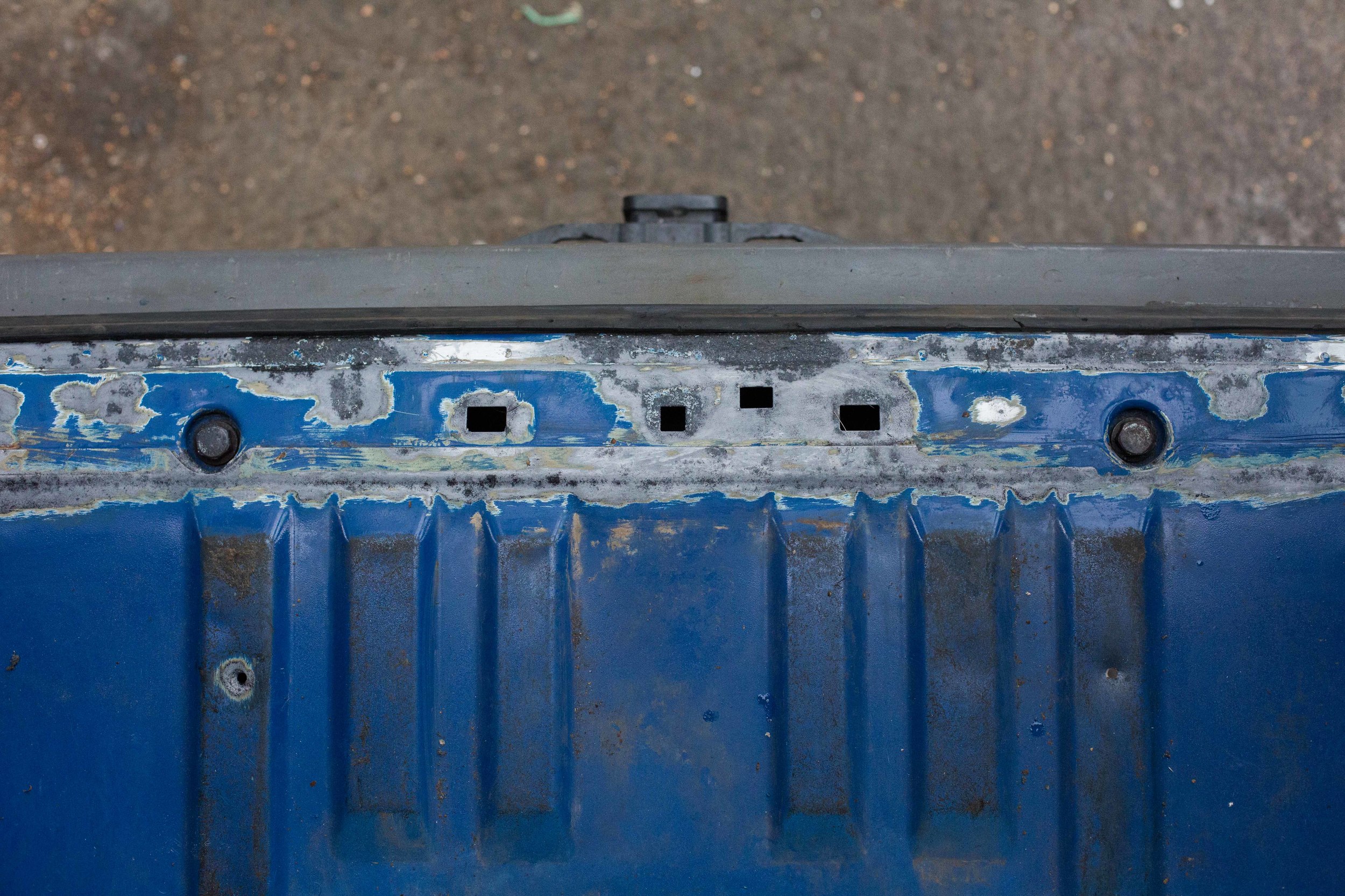 Rust beneath the rear door steps. Had to pull up the plastic step. Most of this was able to be ground out. 