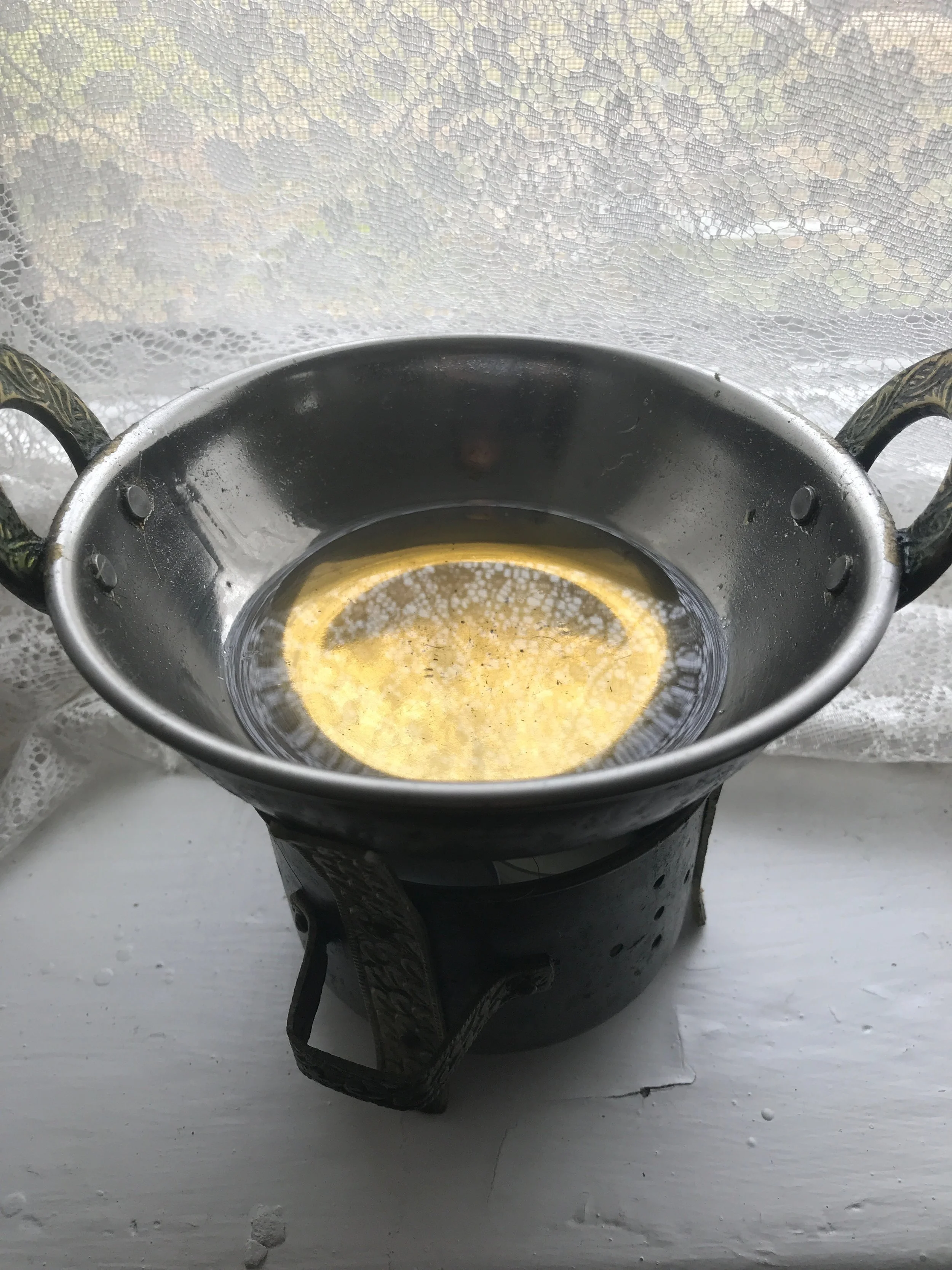This is an image of my special self-massage oil warmer. You can use a pot in the kitchen to warm your oil. You do not NEED on of these. 
