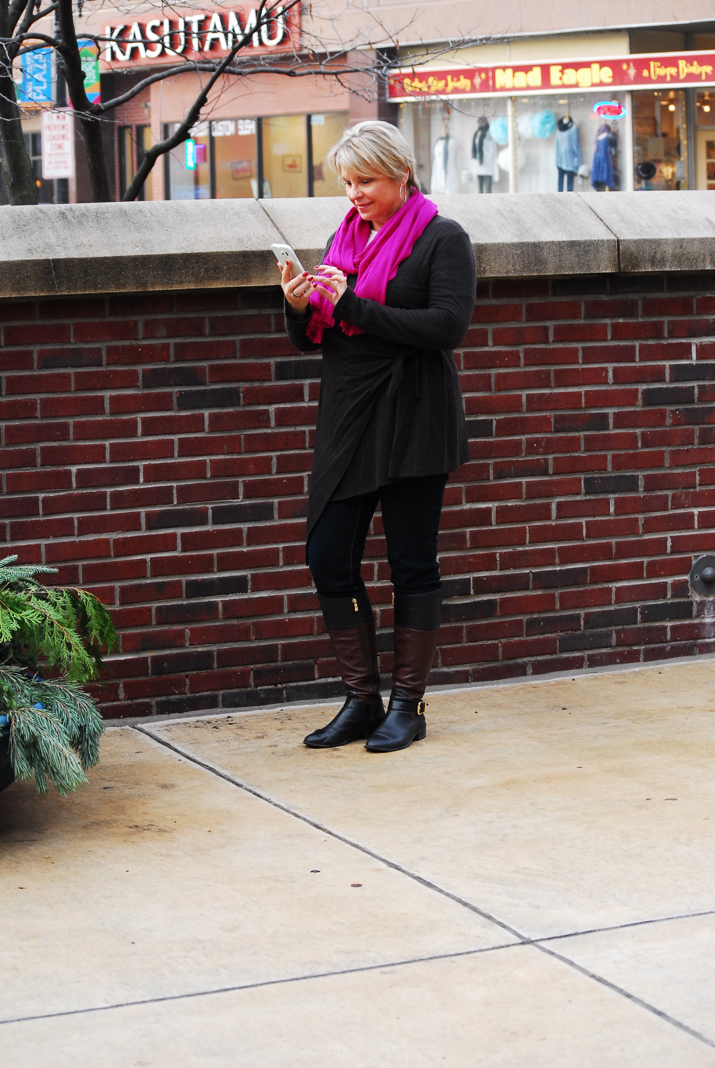 Sherry in Travel Trio One's draped jacket, scarf, jeans and boots (model's own)