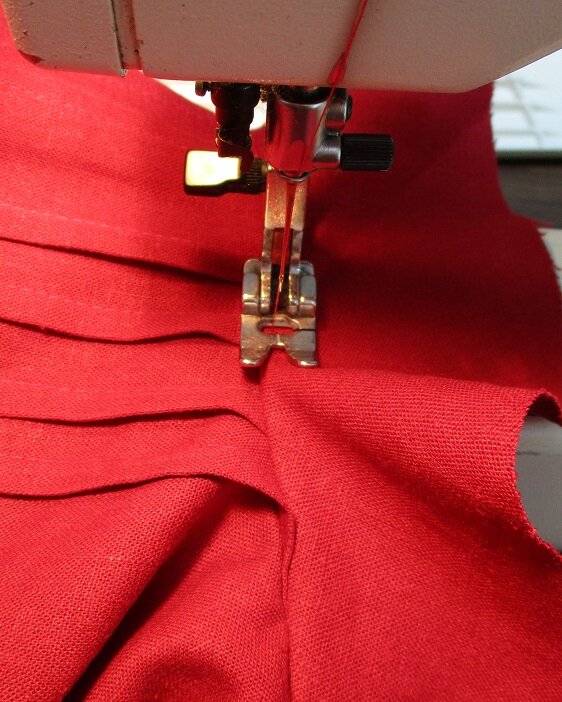  Topstitch facing and dress together, 1/4” from edge around entire neckline.  