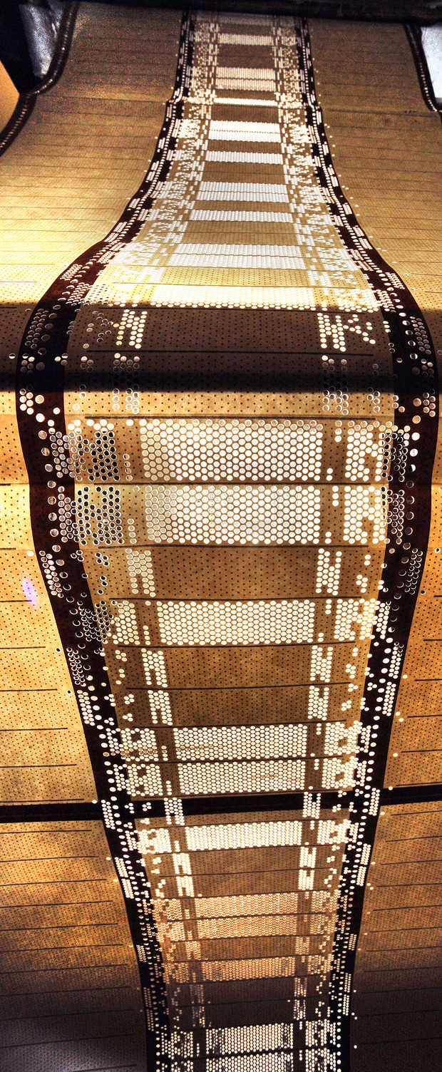 The paper cards act like a simple computer to ultimately create the patterns in the blankets, bedspreads and other material being woven. The technology has been in use since the early 1800s, with only a few upgrades. | RUSS DILLINGHAM/SUN JOURNAL