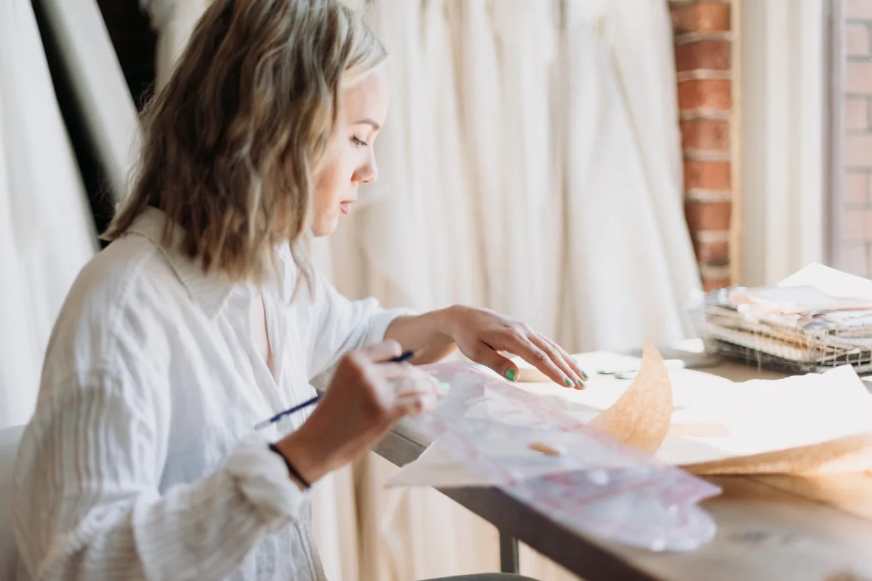 Designer working on wedding dress pattern