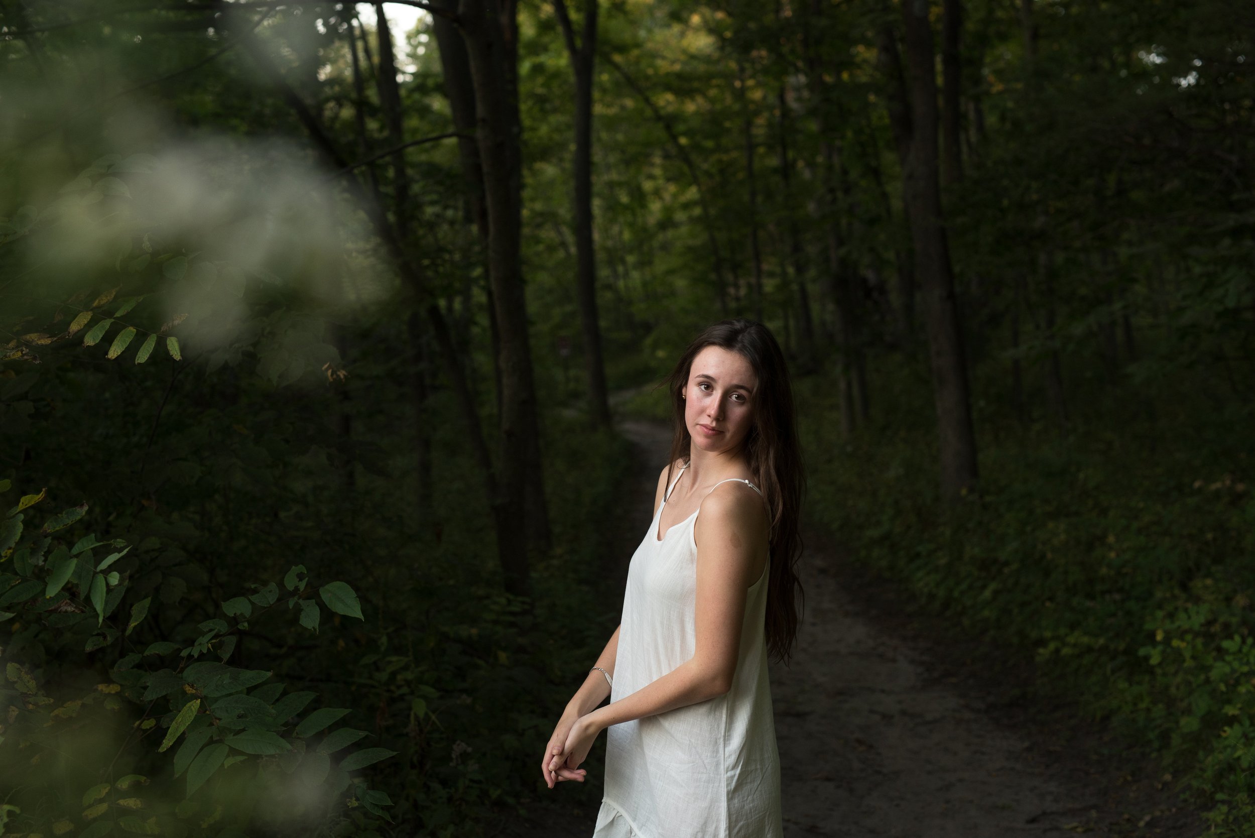 Girl standing in the woods -senior session.jpg