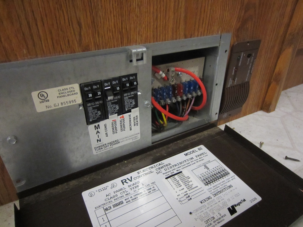  Removed the AC/DC distribution panel (shown), DC converter and battery charger. 