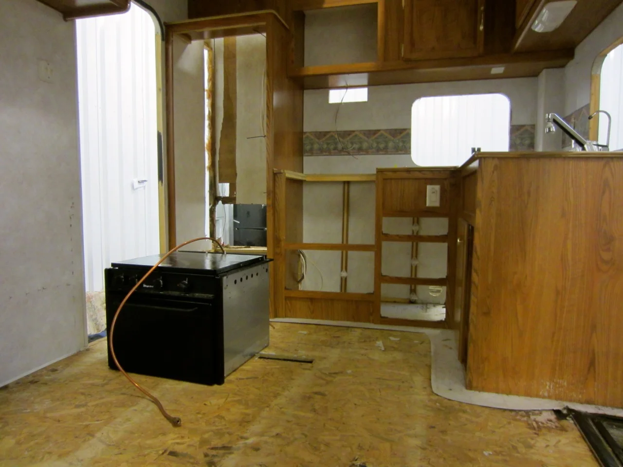 All the kitchen cabinets have to come out since we have to rebuild those walls.
