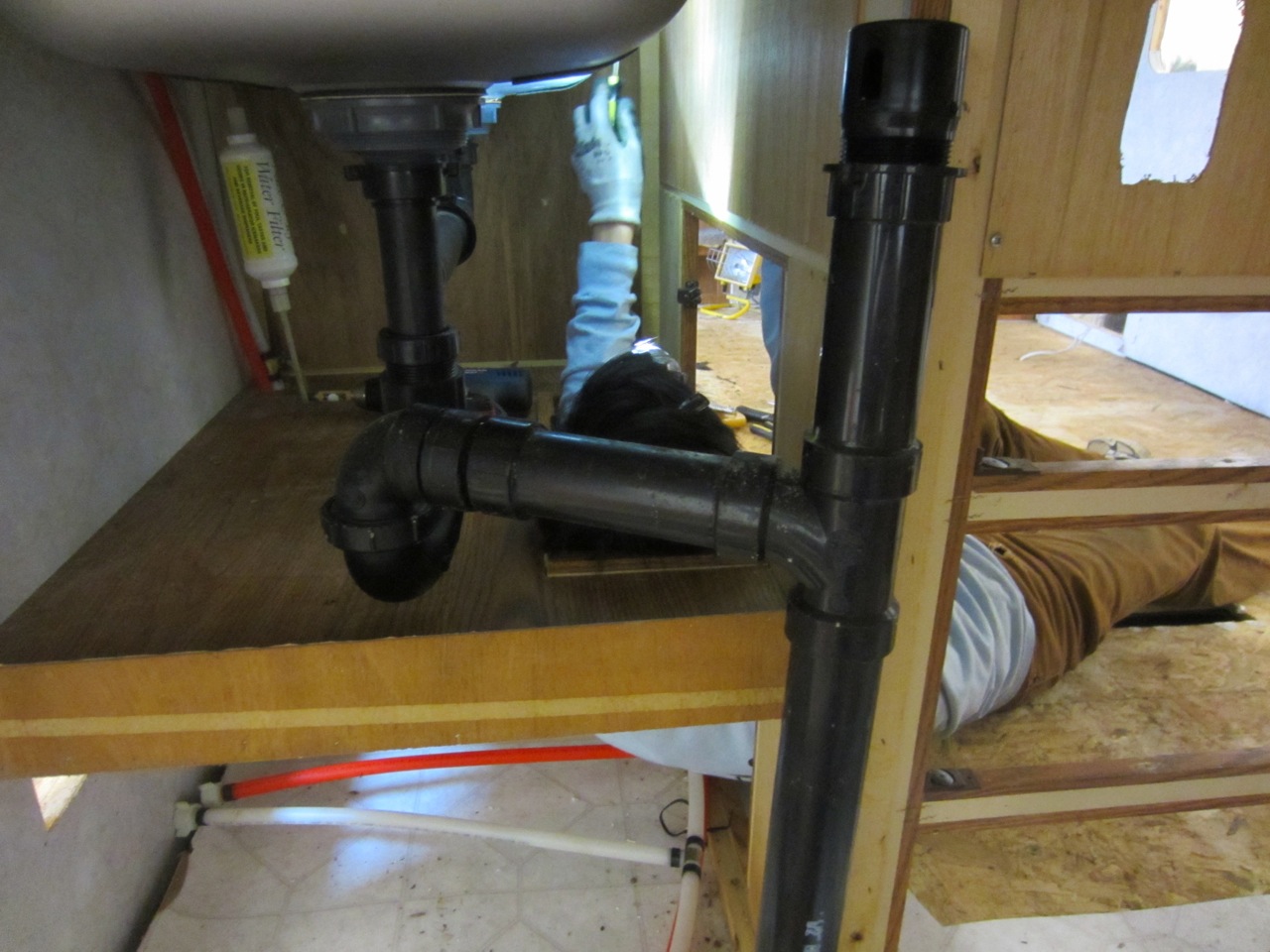  Awkward positions are necessary to unscrew the kitchen sinks and cabinets from inside and above. 