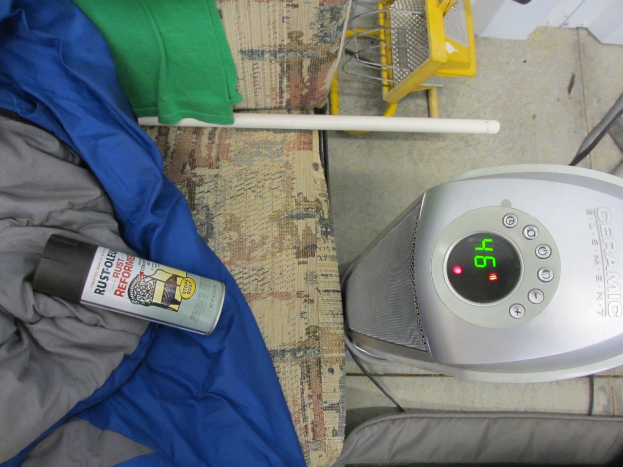The Rust-Oleum has to be around 55° degrees to use. So we had to warm it up in front of the space heater.