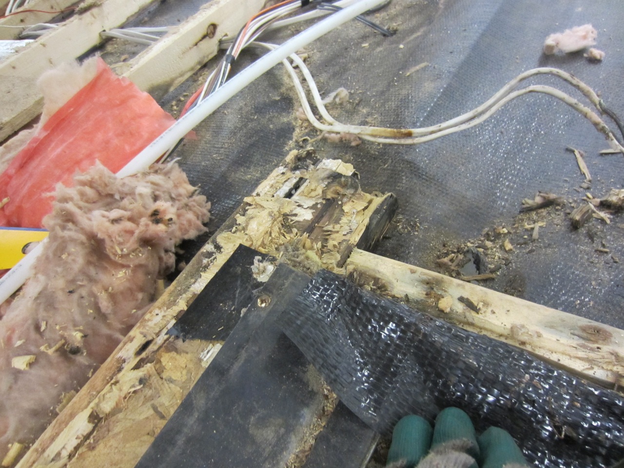  The floor joists are a mess from pieces of sub-floor boards that didn't fully come off. 