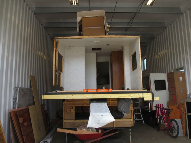  A view of the front of the trailer (bedroom) with the new sill plates installed on the chassis. 