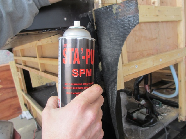 Using adhesive spray, we attached the new underbelly wrap to the old one.